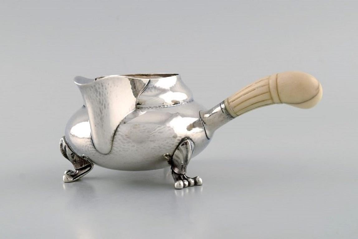 Art Nouveau Georg Jensen Blossom Creamer in Hammered Sterling Silver with Ivory Handle For Sale