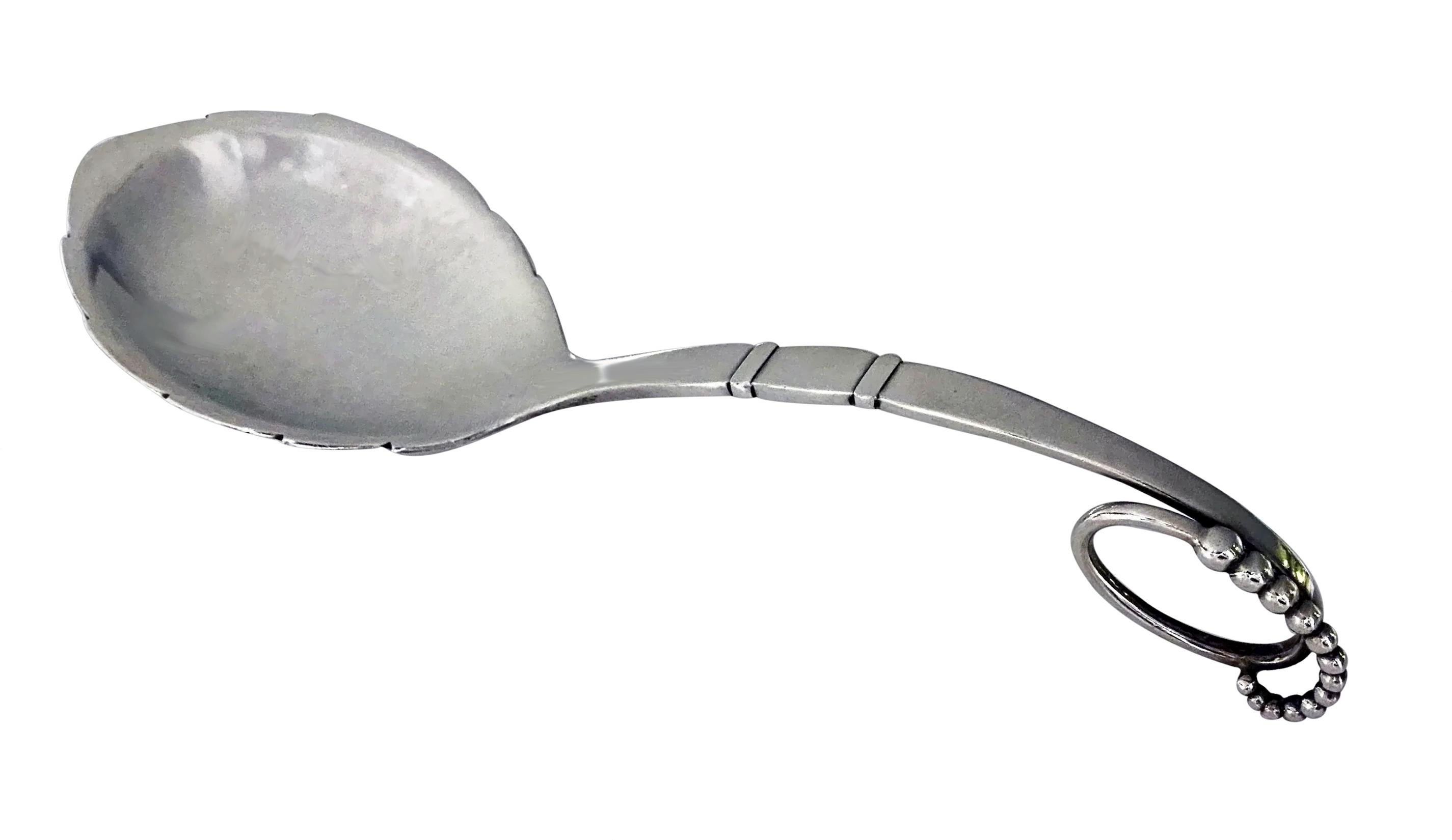 Georg Jensen Blossom Pattern Serving Spoon Ladle Sterling silver Denmark, C.1935. With leaf-form bowl, stamped with GJ mark, 41, Sterling Denmark. Length: 8 inches. Weight: 78 grams. (2.50 oz.)