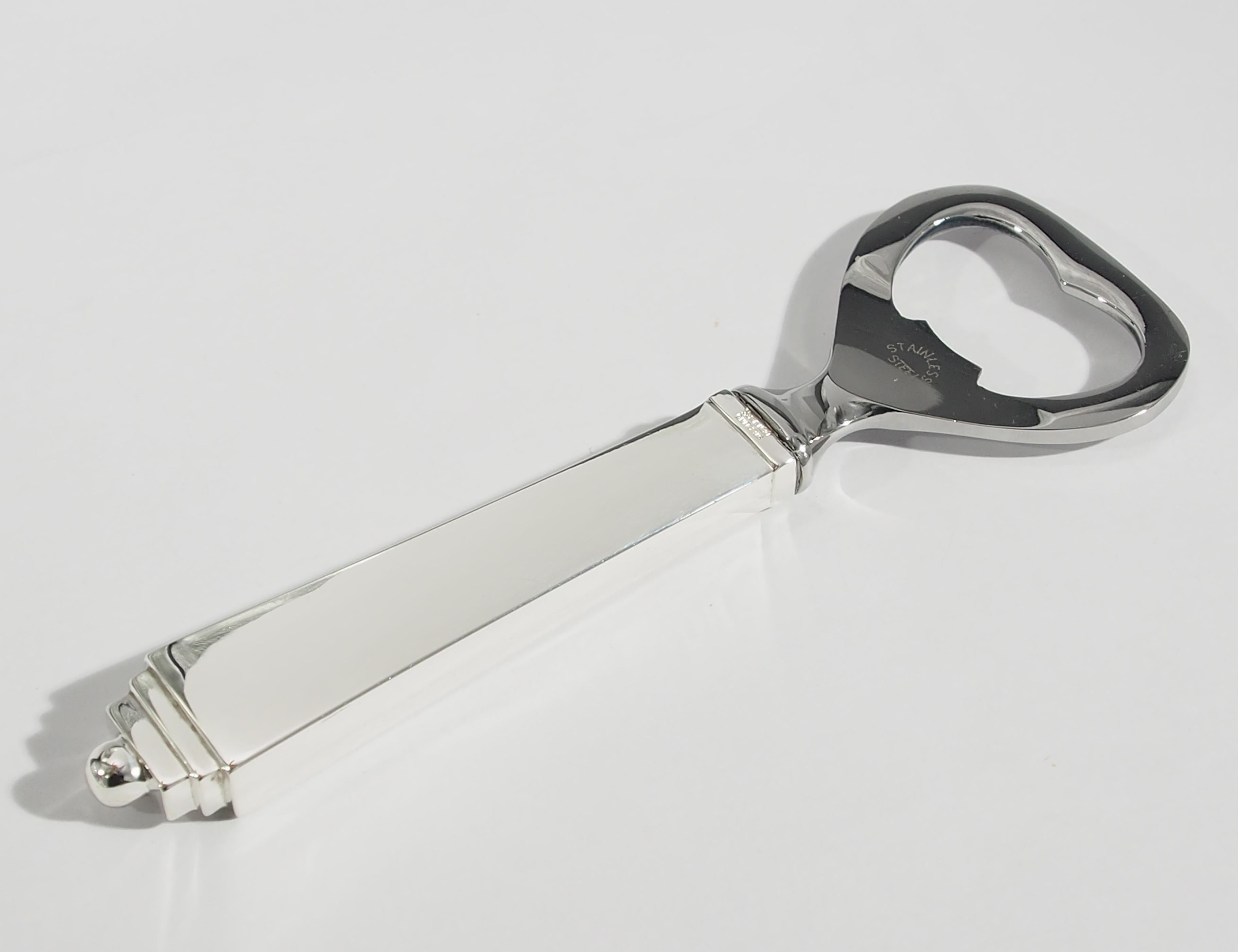 From the respected Sterling Silver Designer, Georg Jensen is this vintage Bottle Opener. Fashioned in a geometric pattern the Opener is 4 1/2 inches in length and tapering from 1/2 inch at the handle to tapering to 1-1/2 inches in width at the top.