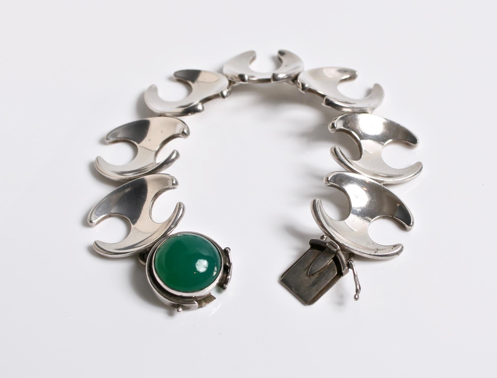 Georg Jensen sterling silver & Green agate cabochon bracelet designed by Henning Koppel Denmark c.1950 
Design number 130 comes in a Georg Jensen box
Tight clasp very rare unusual design
Length 19cm