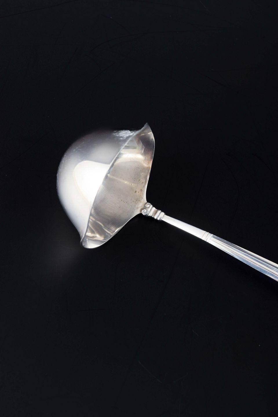 PRE-OWNED GOODS ARE EXEMPT FROM IMPORT TARIFFS FOR U.S., UK, AUSTRALIAN & CANADIAN CUSTOMERS.   
THEREFORE, NO IMPORT TARIFFS WILL BE APPLICABLE TO YOUR PURCHASE. 

Georg Jensen
Butter sauce ladle in the “Acorn” pattern.
Sterling silver.

Designer: