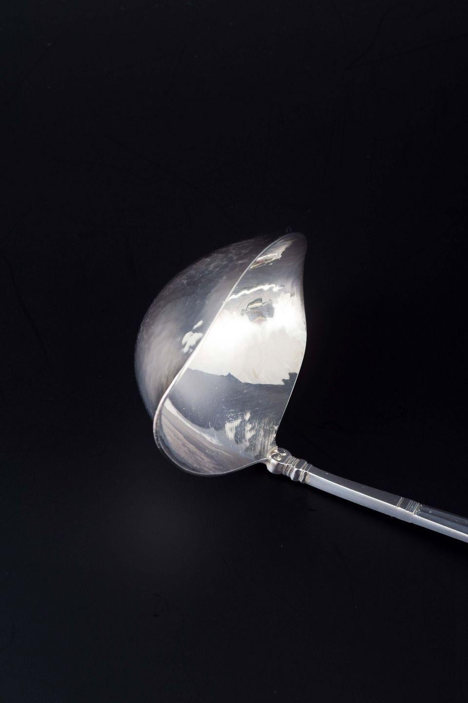 PRE-OWNED GOODS ARE EXEMPT FROM IMPORT TARIFFS FOR U.S., UK, AUSTRALIAN & CANADIAN CUSTOMERS.   
THEREFORE, NO IMPORT TARIFFS WILL BE APPLICABLE TO YOUR PURCHASE. 

Georg Jensen
Butter sauce ladle in the “Acorn” pattern.
Sterling silver.

Designer: