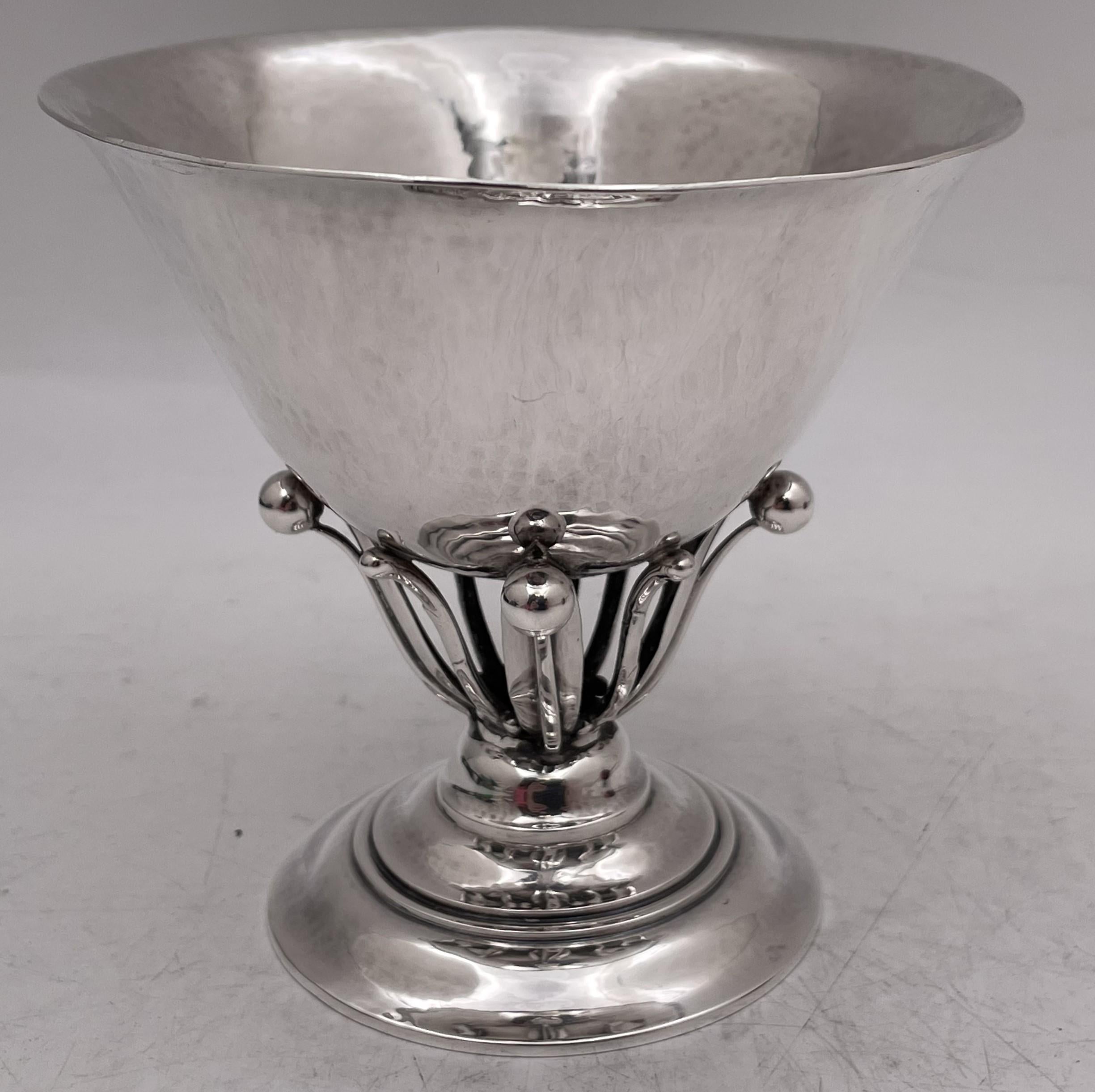 Georg Jensen sterling silver bowl, designed by Johan Rohde, in pattern number 17A, beautifully hand hammered, showcasing stylized natural motifs, and standing on a stepped circular base. It measures 4 1/4'' in diameter by 4 1/8'' in height, weighs 6