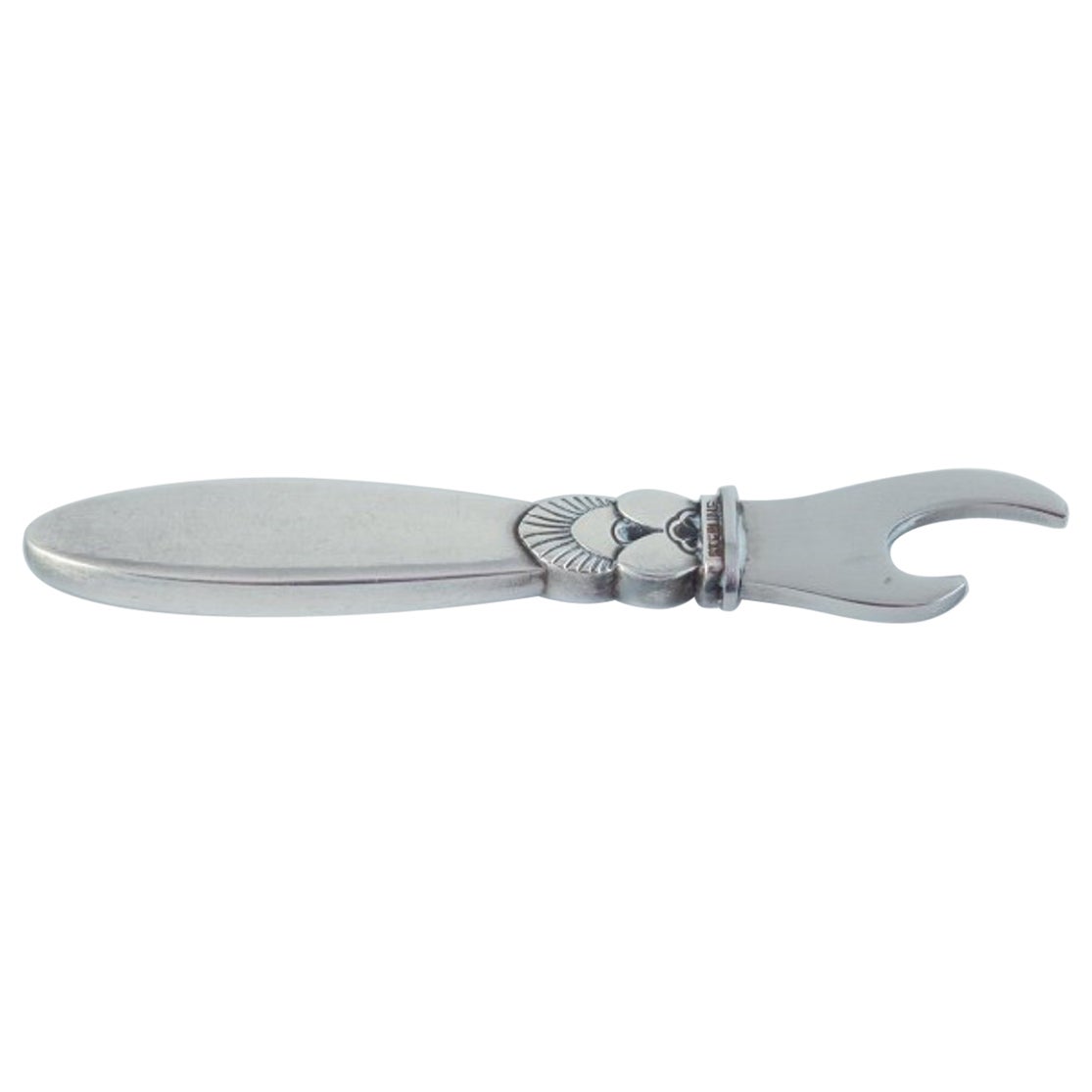 Cactus von Georg Jensen. Flaschenöffner aus Sterlingsilber und Edelstahl.
