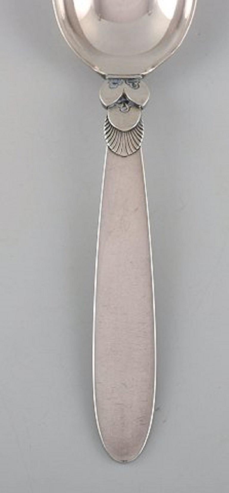 Georg Jensen cactus dessert spoon in sterling silver. 12 pieces in stock.
Designer: Gundorph Albertus.
Measures: 17 cm.
Stamped.
In very good condition.