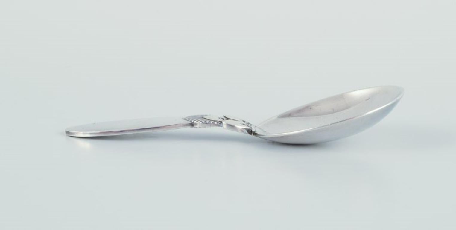 Georg Jensen Cactus. Small compote spoon in sterling silver.
Hallmarked after 1944.
In perfect condition.
Dimensions: Length 9.6 cm.