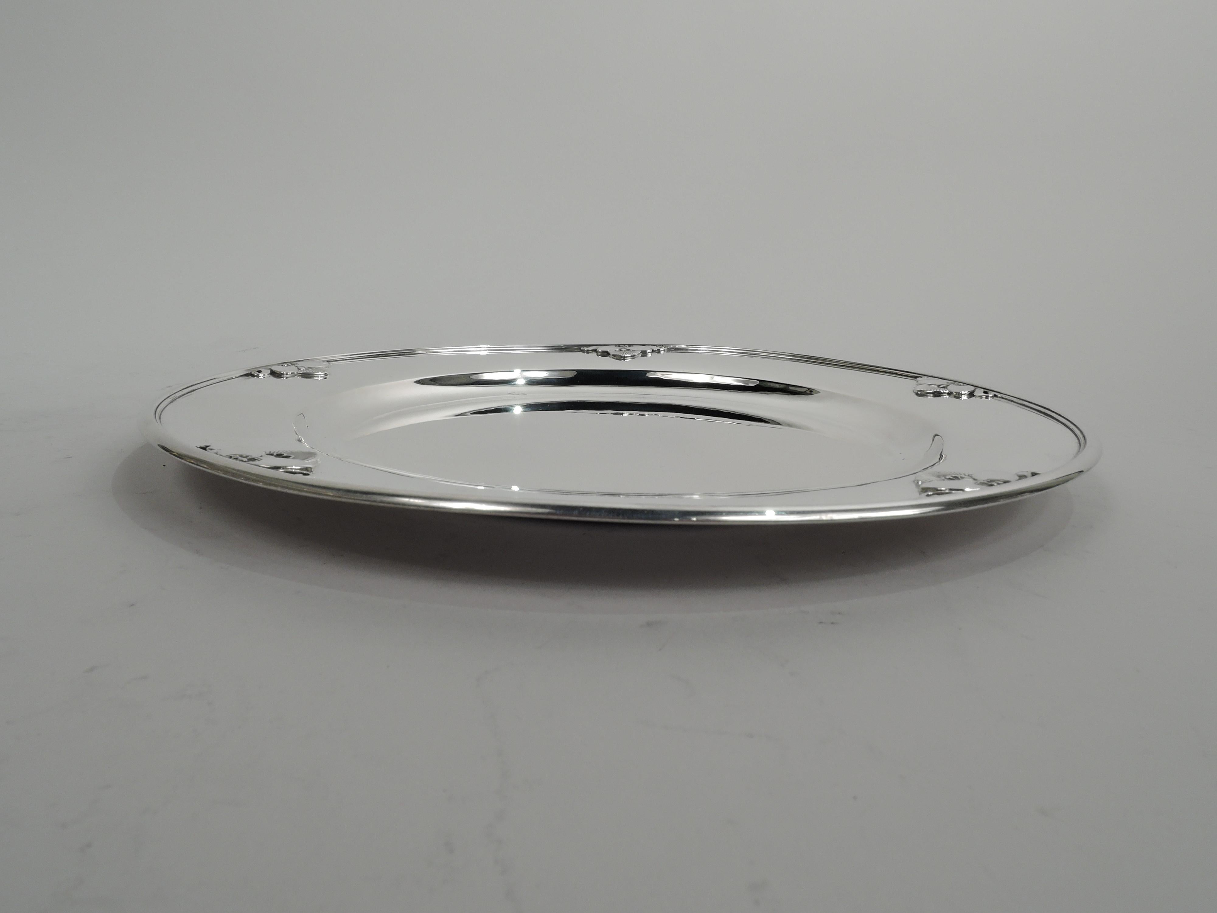 Cactus sterling silver dinner plate charger. Made by Georg Jensen in Copenhagen. Round well and sloping shoulder. Applied to rim are stylized cacti set in leaves between scrolls. A gorgeous piece in the historic pattern designed by Gundorph