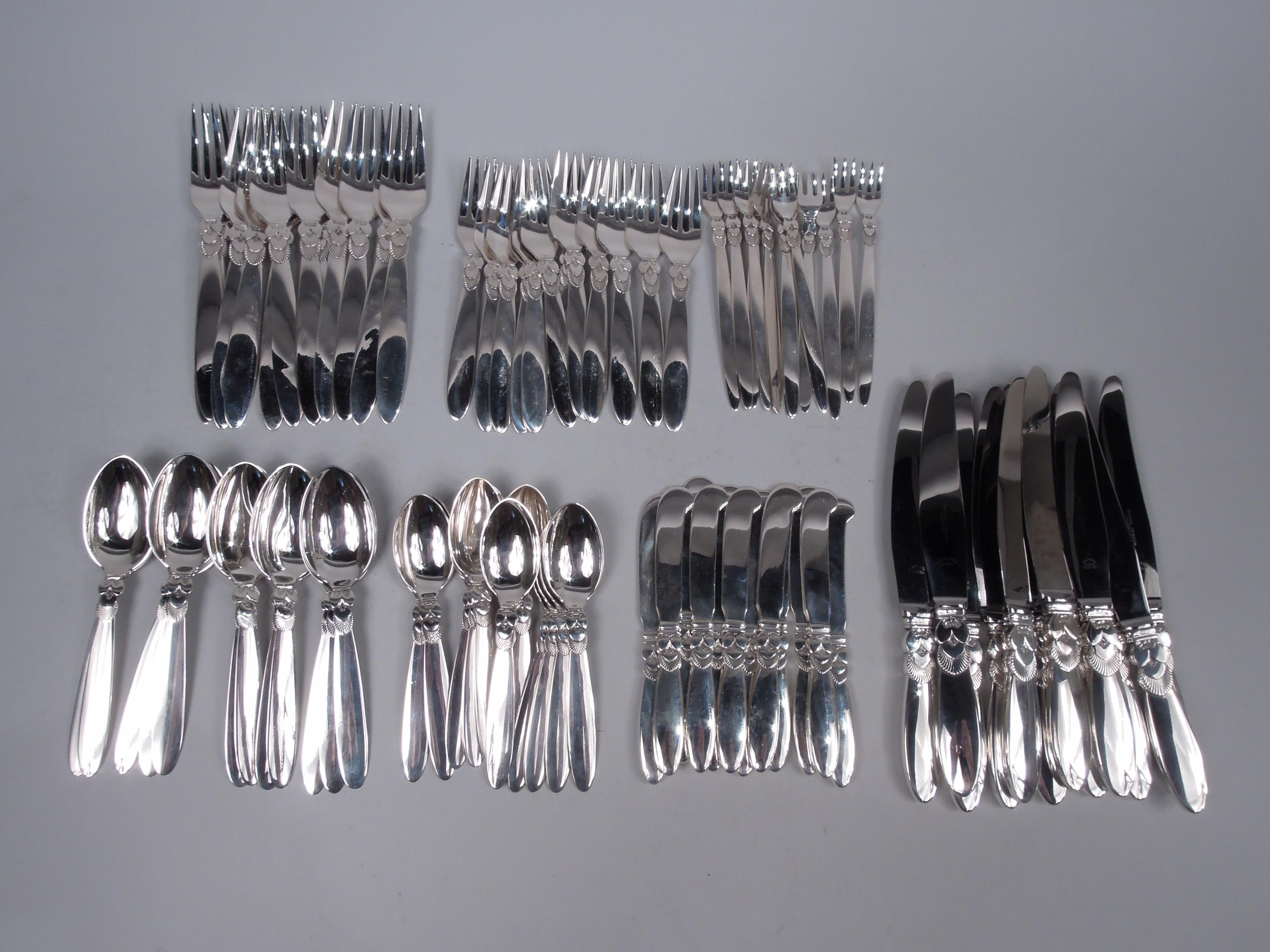 Cactus sterling silver dinner set. Made by Georg Jensen in Copenhagen. This set comprises 84 pieces (dimensions in inches):

Forks: 12 dinner forks (7 3/4), 12 luncheon forks (6 1/2), and 12 seafood forks (6 1/4);

Spoons: 12 dessert spoons (6 3/4)