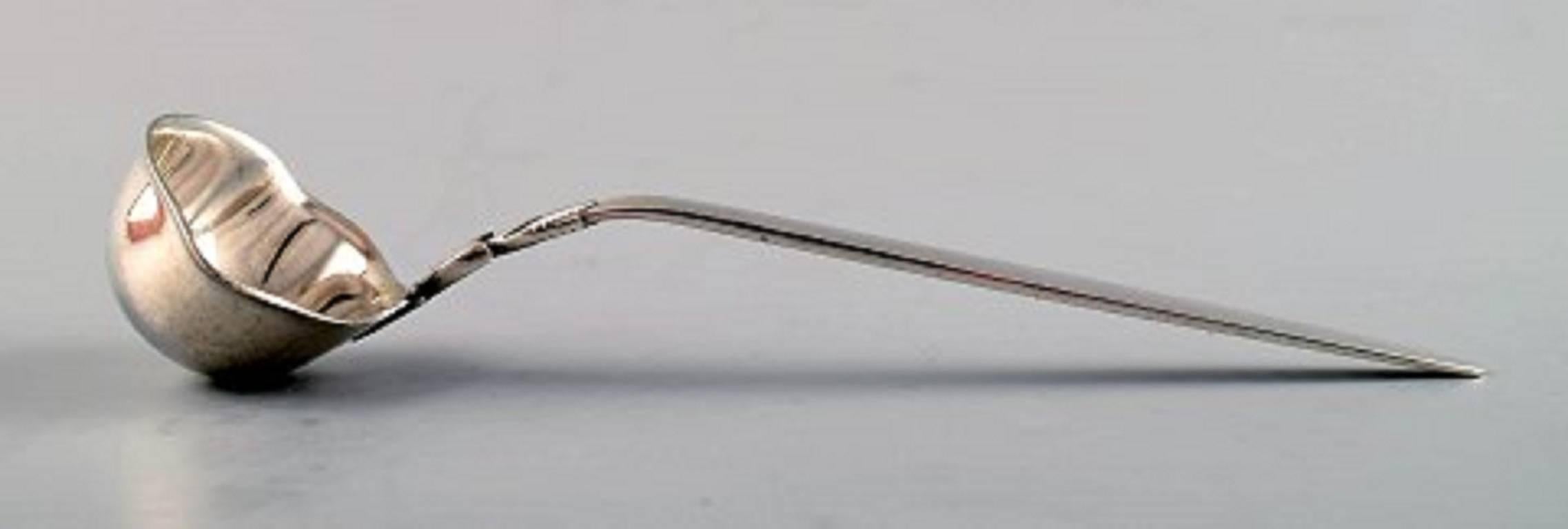 Georg Jensen cactus sterling silver sauce or butter spoon.
Stamped: GJ. Sterling. Import stamps.
Measures: Length 15 cm.
In very good condition.
