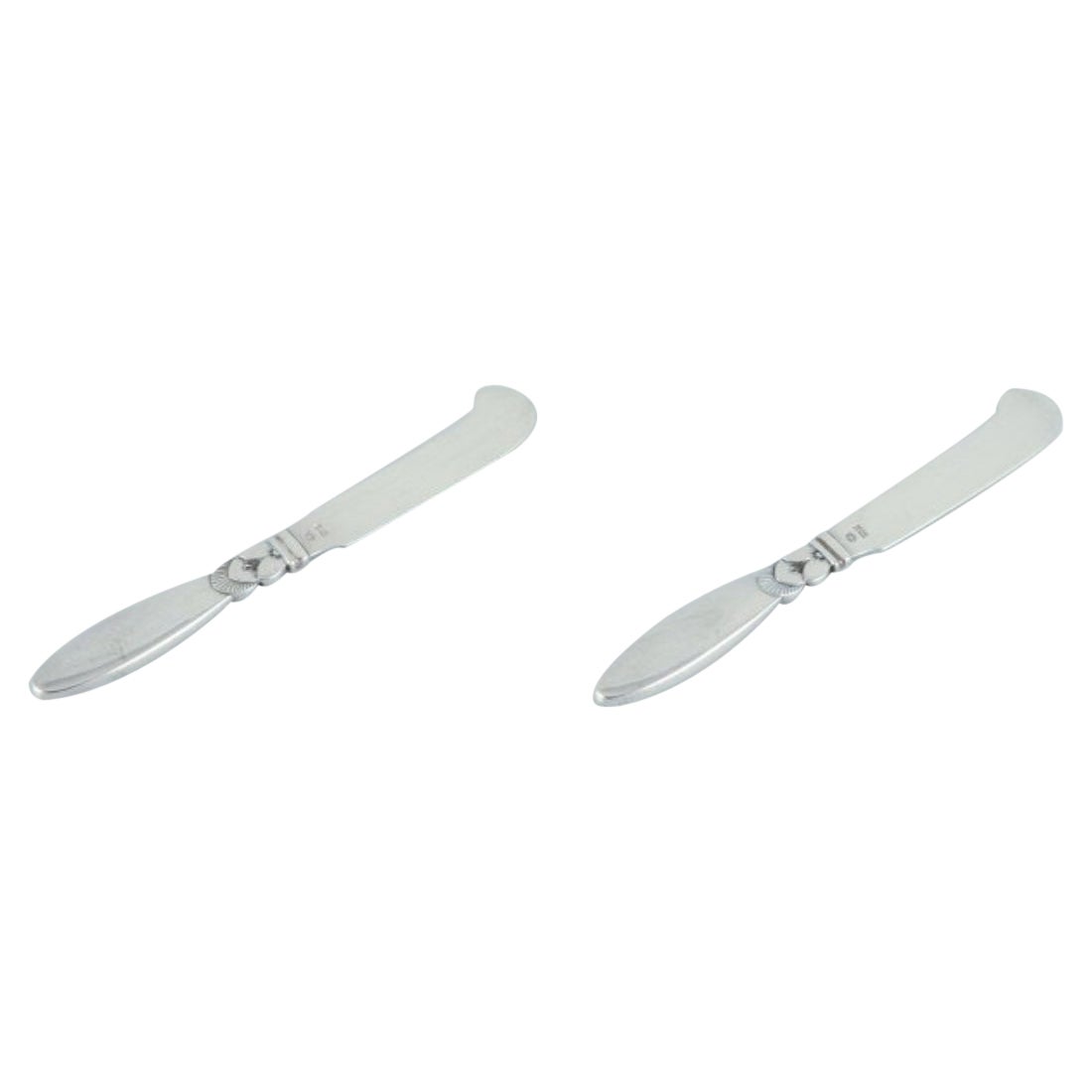 Georg Jensen Cactus. Two all-silver butter knives.