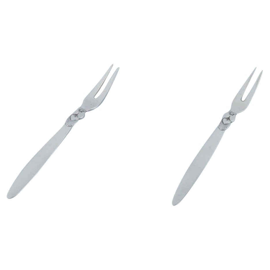 Georg Jensen, Cactus, deux fourchettes de présentation/ fourchettes à franges en argent sterling.