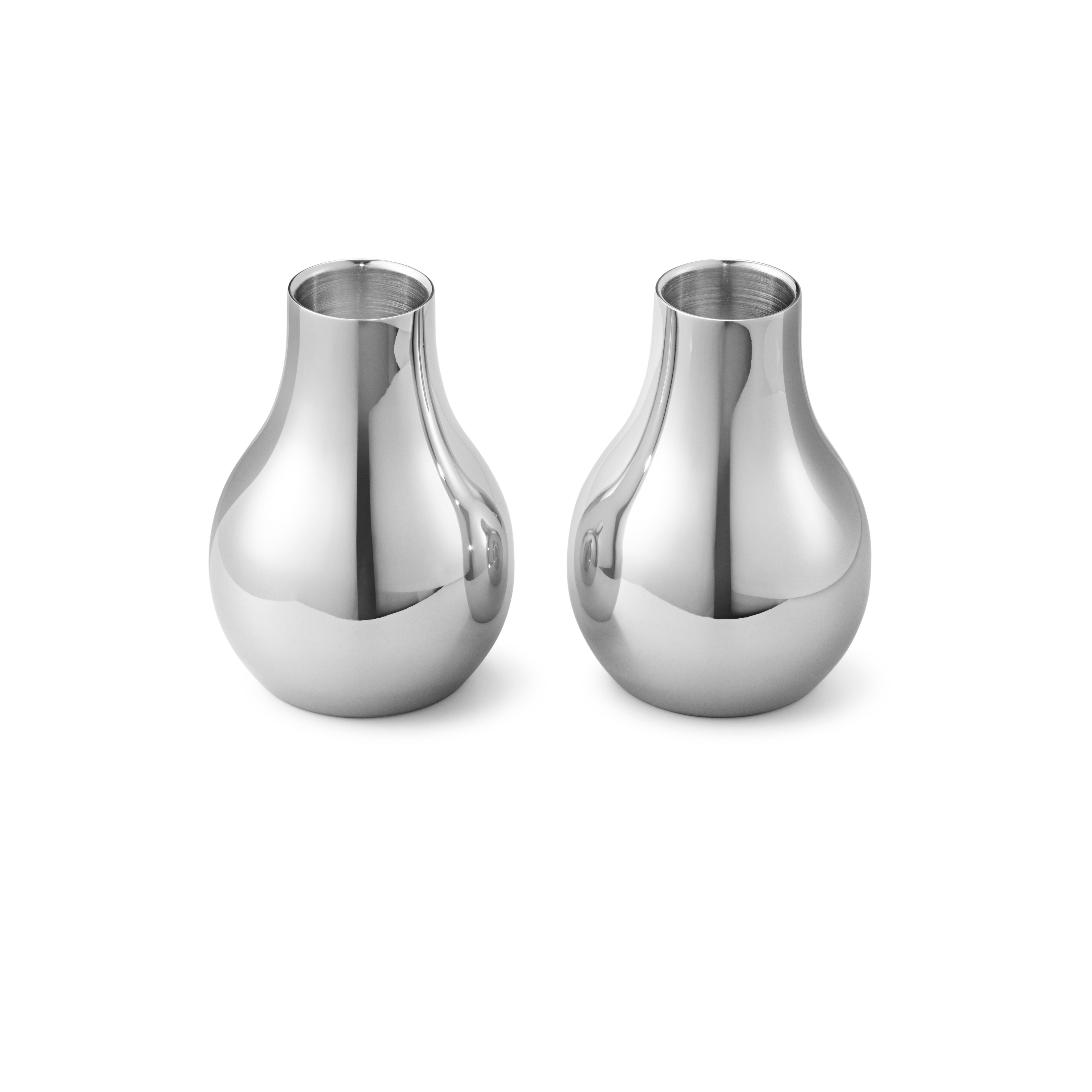 Set of two small candleholders in stainless steel with mirror finish.

Understated elegance emanates from the alluring soft contours of the Cafu collection designed by Holmbäck Nordentoft as a tribute to the Georg Jensen legacy of great designers.