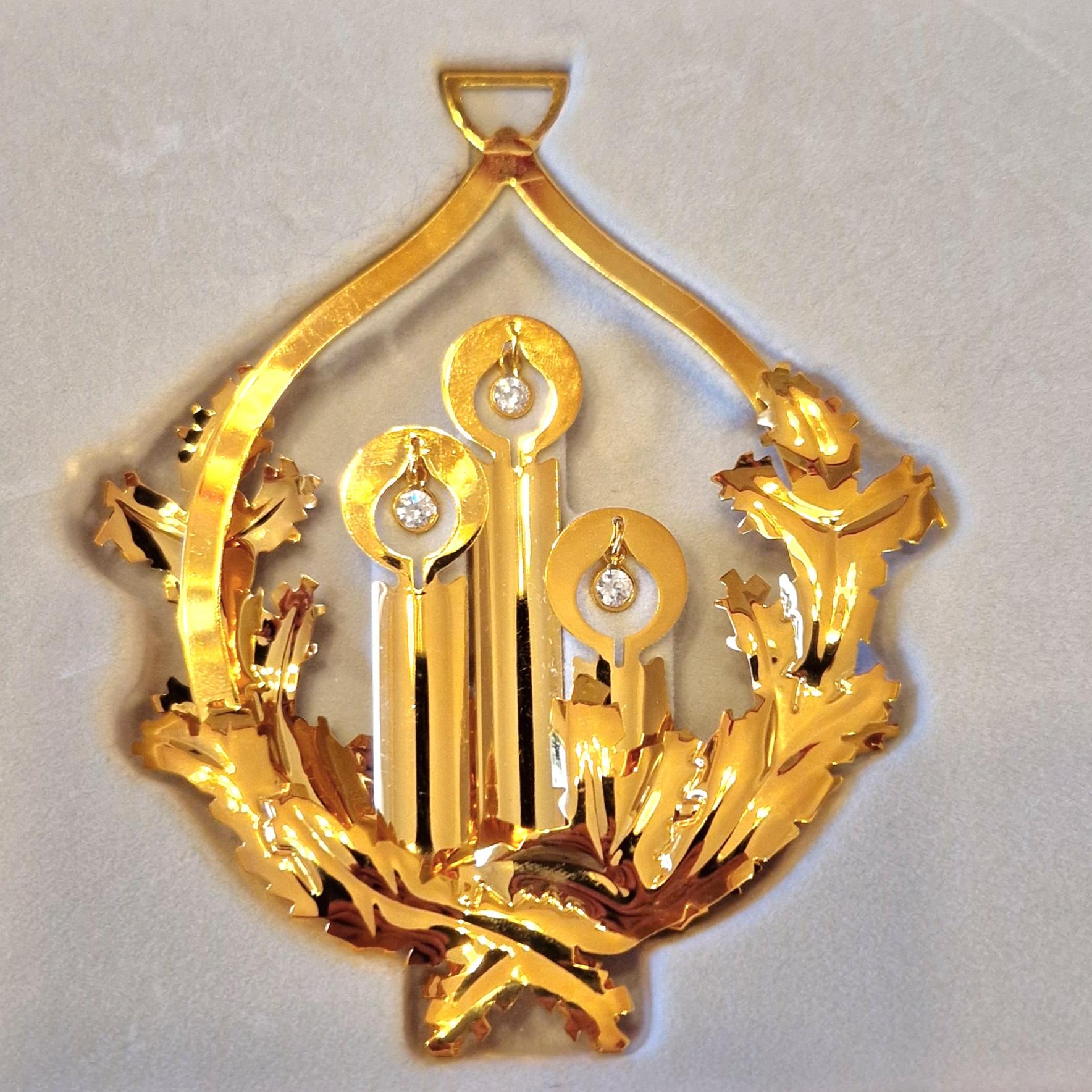 Every year a well-known Danish artist designs the Georg Jensen Christmas Ornament. In its many incarnations over the years it has become a tradition representative of Danish handcrafts - and a much-loved decorations in many homes. 
Artist Nina