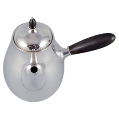 Georg Jensen coffee pot in sterling silver with an ebony handle and lid knob.