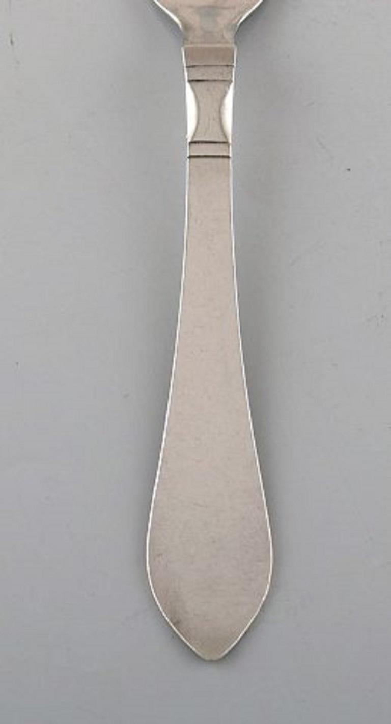 Georg Jensen Continental lunch fork in hammered sterling silver. Three pieces in stock.
The cutlery is designed by Georg Jensen in 1906.
Stamped.
In perfect condition.
Measures: 17 cm.