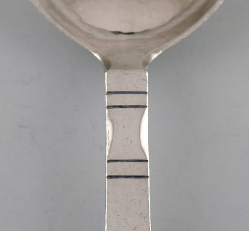 Danish Georg Jensen Continental Serving Spoon in Hammered Sterling Silver For Sale