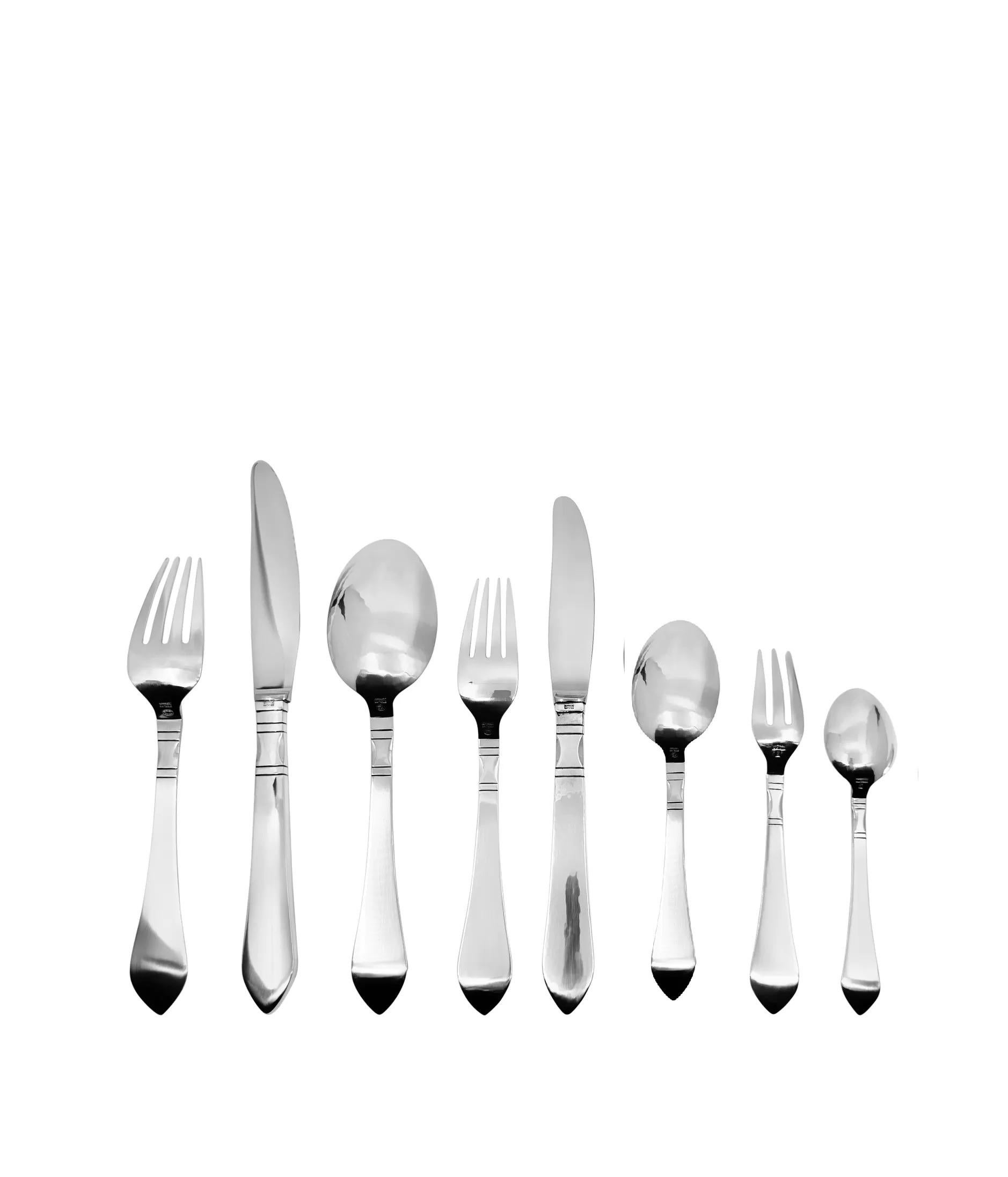 A vintage Georg Jensen sterling silverware service for twelve in the Continental pattern, design #4, created by Georg Jensen in 1906. This highly sought-after hand-hammered pattern is a stunning example of Art Nouveau design, distinguished by its