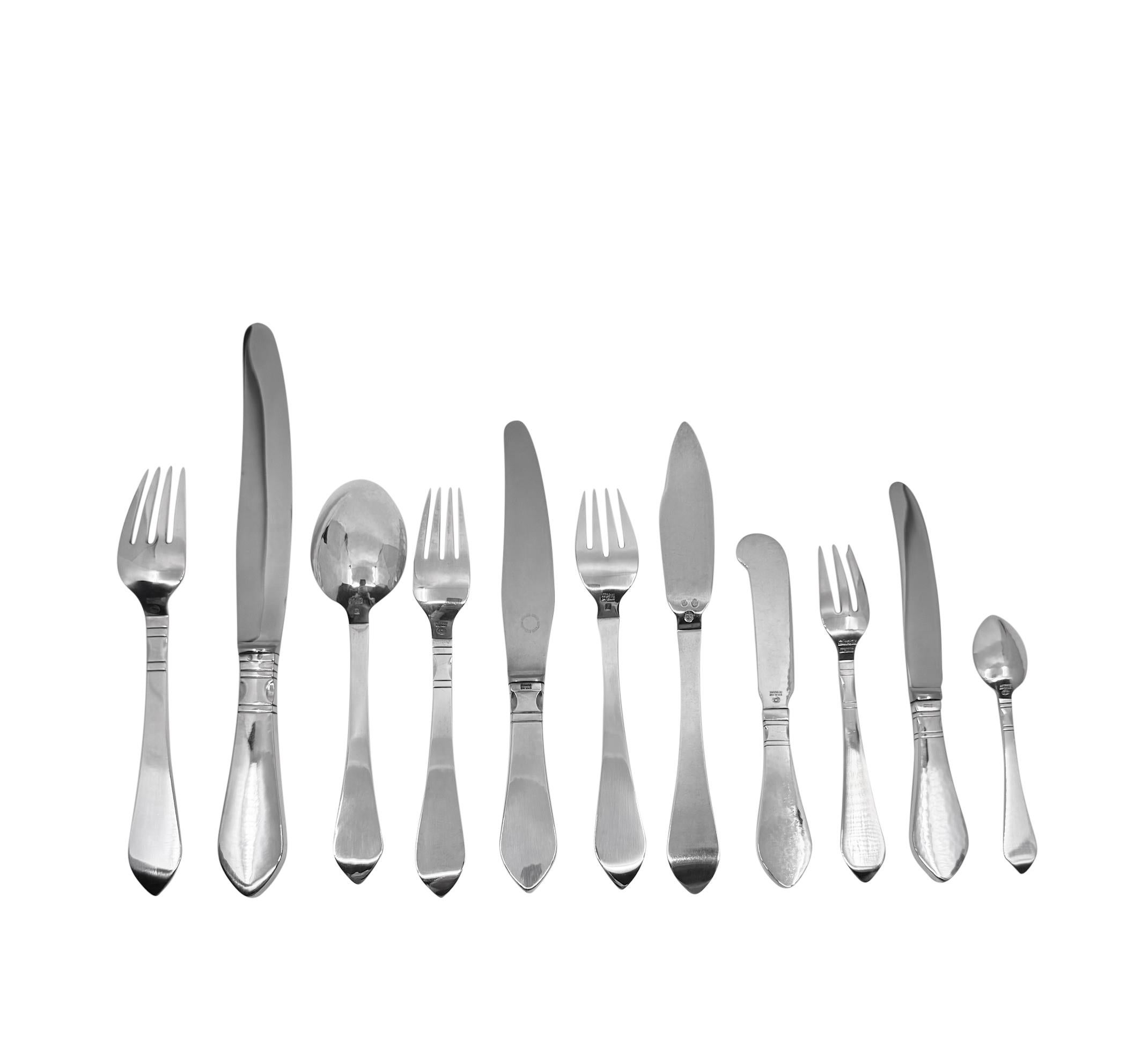 An extensive vintage Georg Jensen sterling silverware service for 12 in the Continental pattern, pattern #4 by Georg Jensen designed in 1906. This service comprises 12 settings, each setting of 11 pieces, a total of 132 pieces.

This set includes