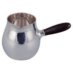 Georg Jensen creamer in sterling silver with an ebony handle. Model 80A.