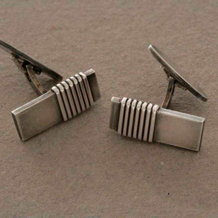 Georg Jensen Cufflinks No. 80 by Harald Nielsen 

Art Deco design from the 1940s.  

Excellent condition.

Harald Nielsen bio: Harald Nielsen (1892 - 1977) is an important figure in the history of the Georg Jensen Silversmithy. He was not only a