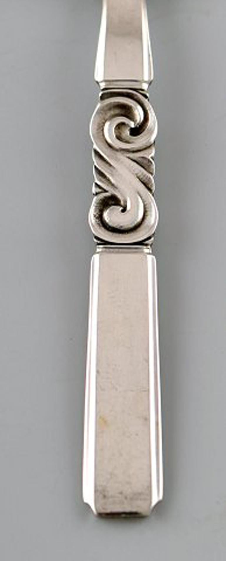 Georg Jensen. Cutlery, Scroll no. 22, hammered Sterling Silver. Coffee spoon. Six pieces in stock.
In perfect condition.
Stamped.
Measures: 11 cm.