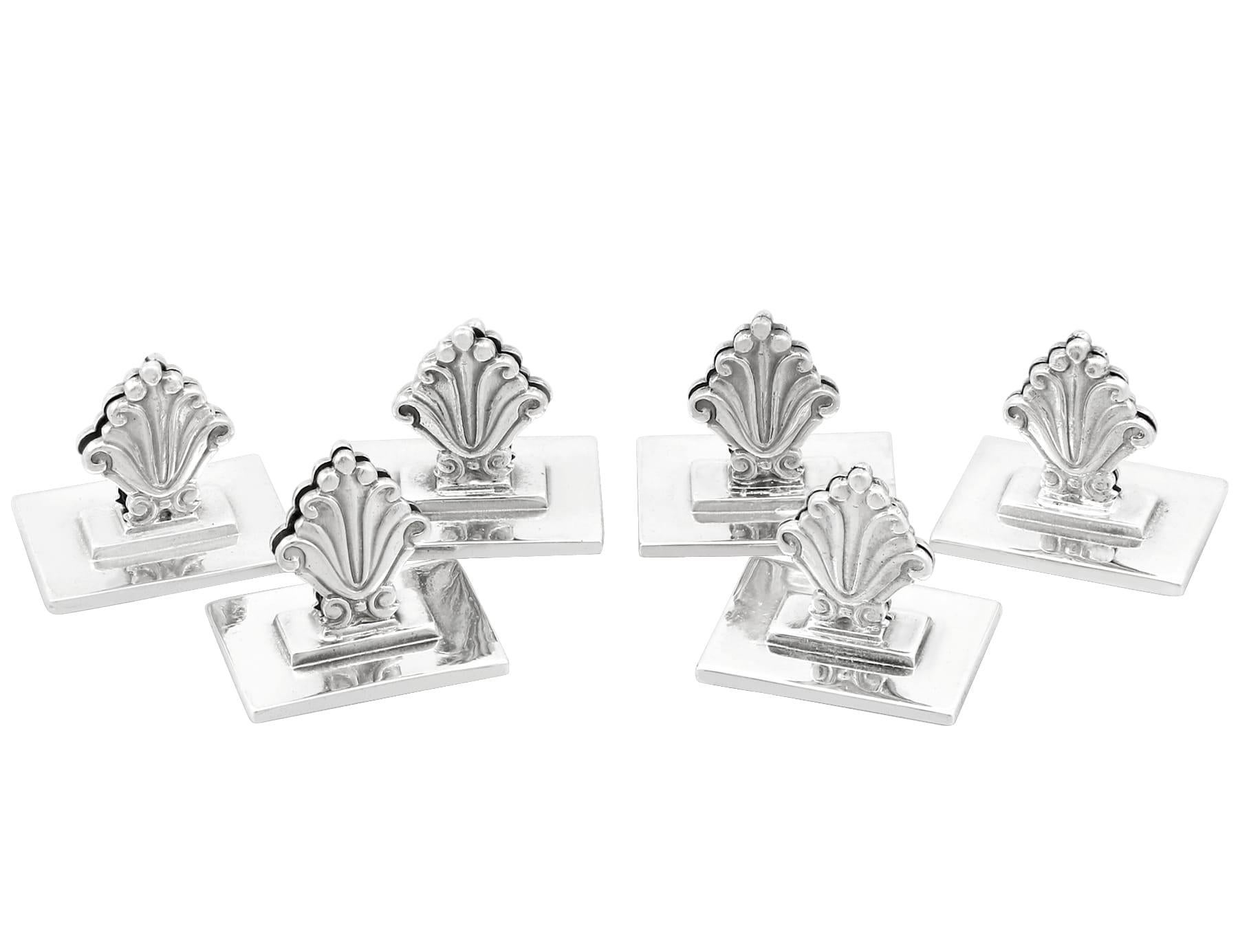 An exceptional, fine and impressive set of six antique Danish cast sterling silver menu / card holders made by Georg Jensen; an addition to our diverse dining silverware collection.

These exceptional antique Danish cast sterling silver menu card
