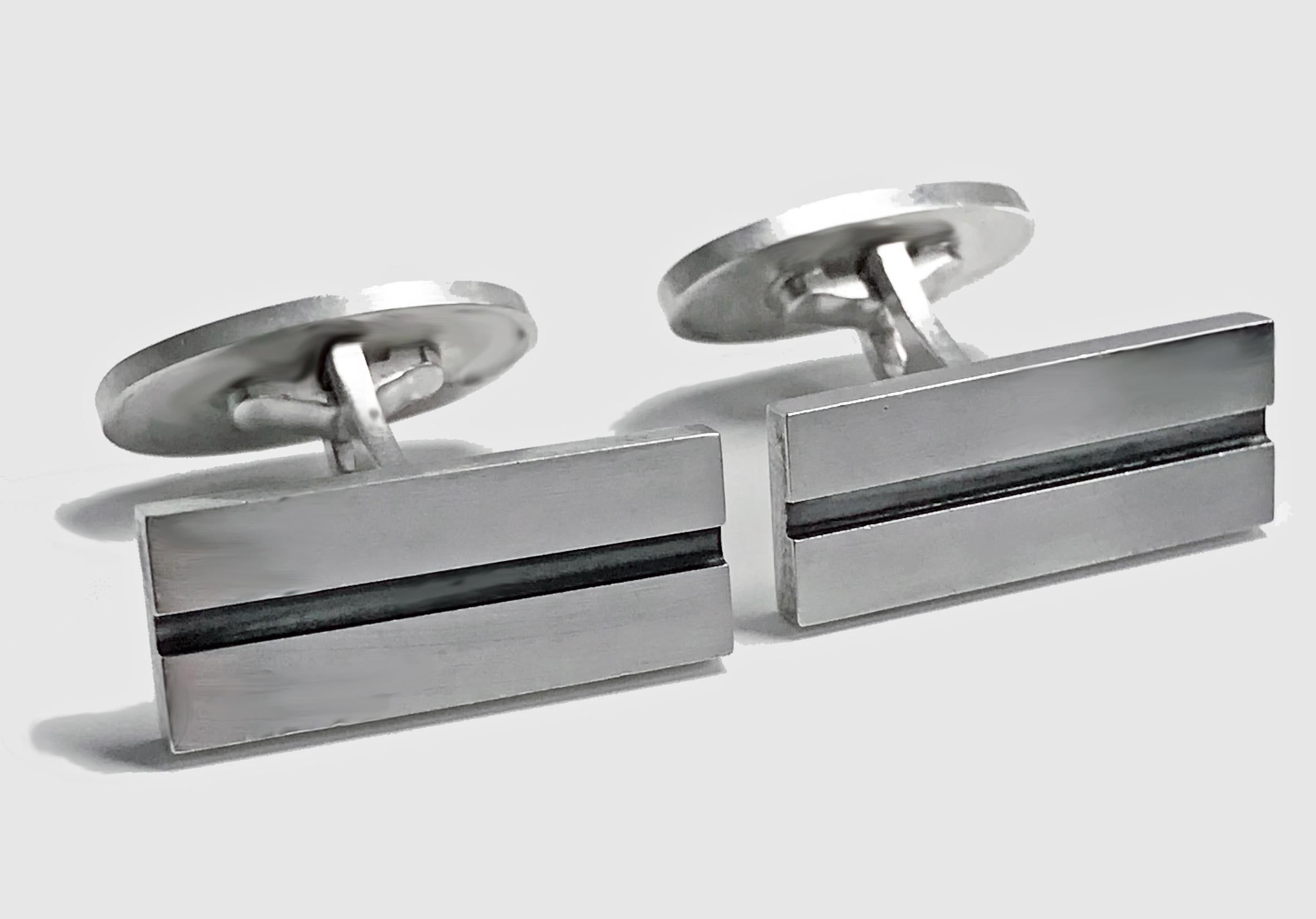 Georg Jensen Art Deco style Sterling Cufflinks No 114. Rectangular with central oxidized groove bar recessed., Hinged oval backs. Full Georg Jensen marks in oval dotted, 925 S Denmark and No 114. Front measures: 22 x 9 mm. Total Item Weight: 14.1