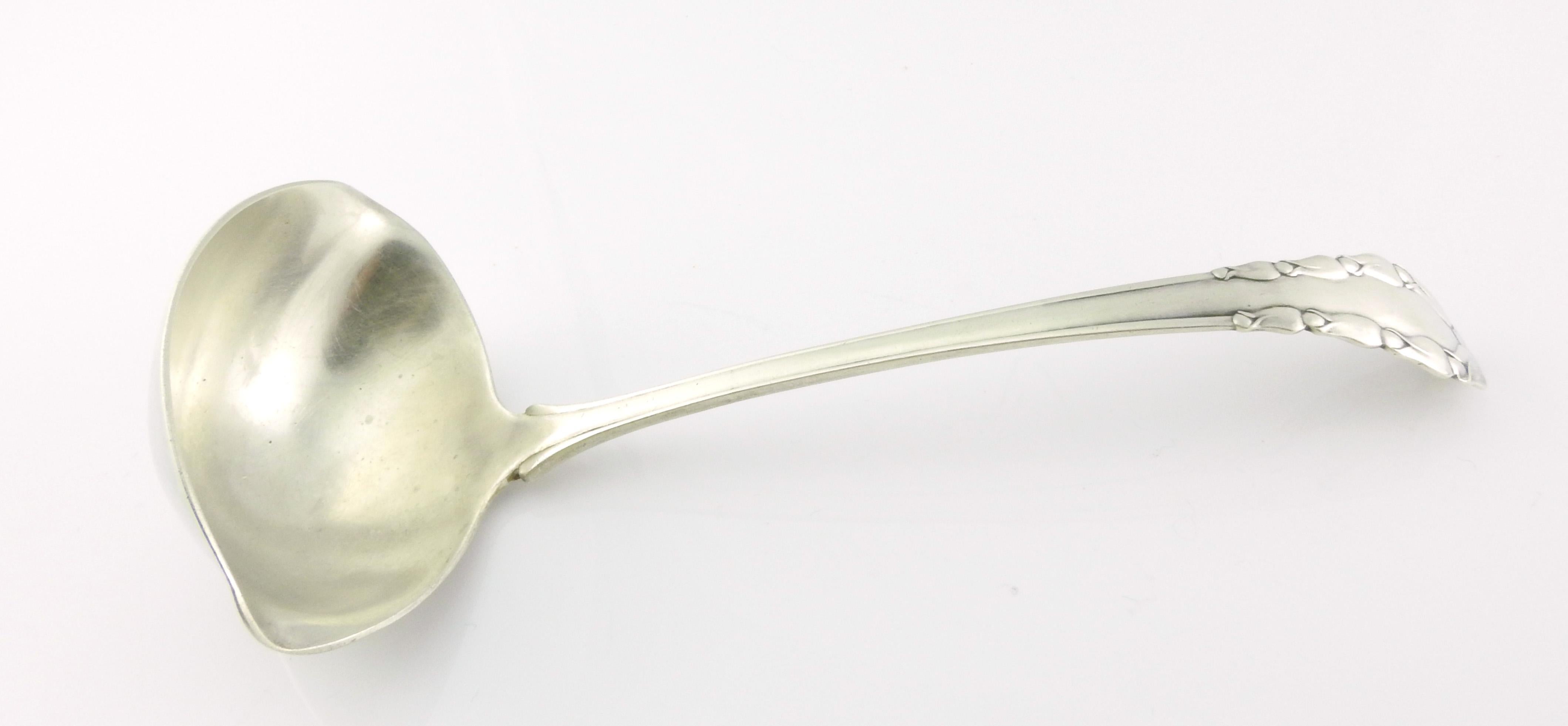 Georg Jensen Denmark 1913 lily of the valley solid gravy ladle

This is a lovely sterling silver gravy ladle with spout, in the pattern 1913 Lily of the Valley by Georg Jensen.

Measurement: Measures approximate 7 inches in length. Bowl