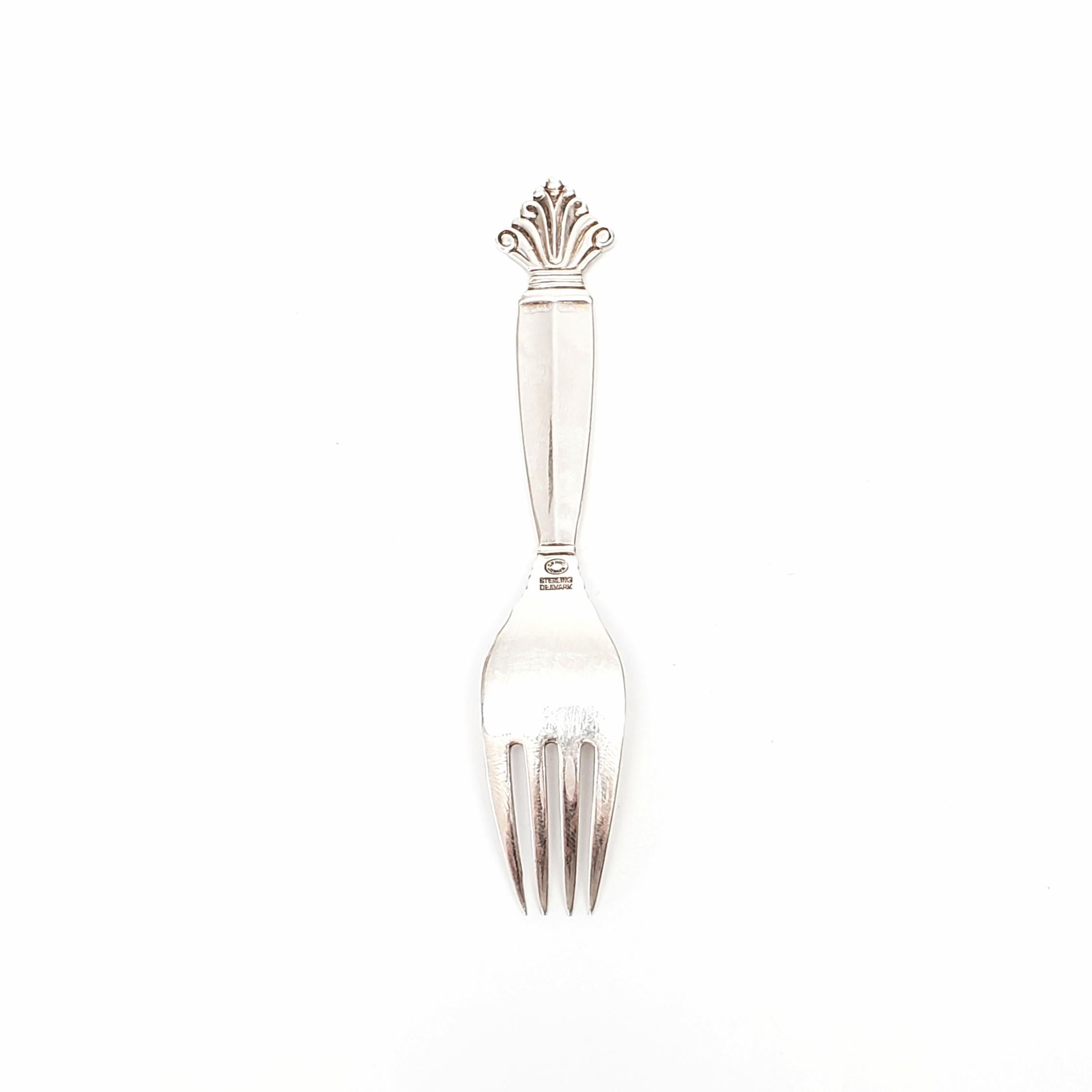 Vintage sterling silver baby fork from Georg Jensen in the Acanthus 1917 pattern.

The Acanthus pattern was designed by Johan Rohde and introduced in 1917. The inspiration for this pattern is not of nature, but a Classic motif treated in a rather