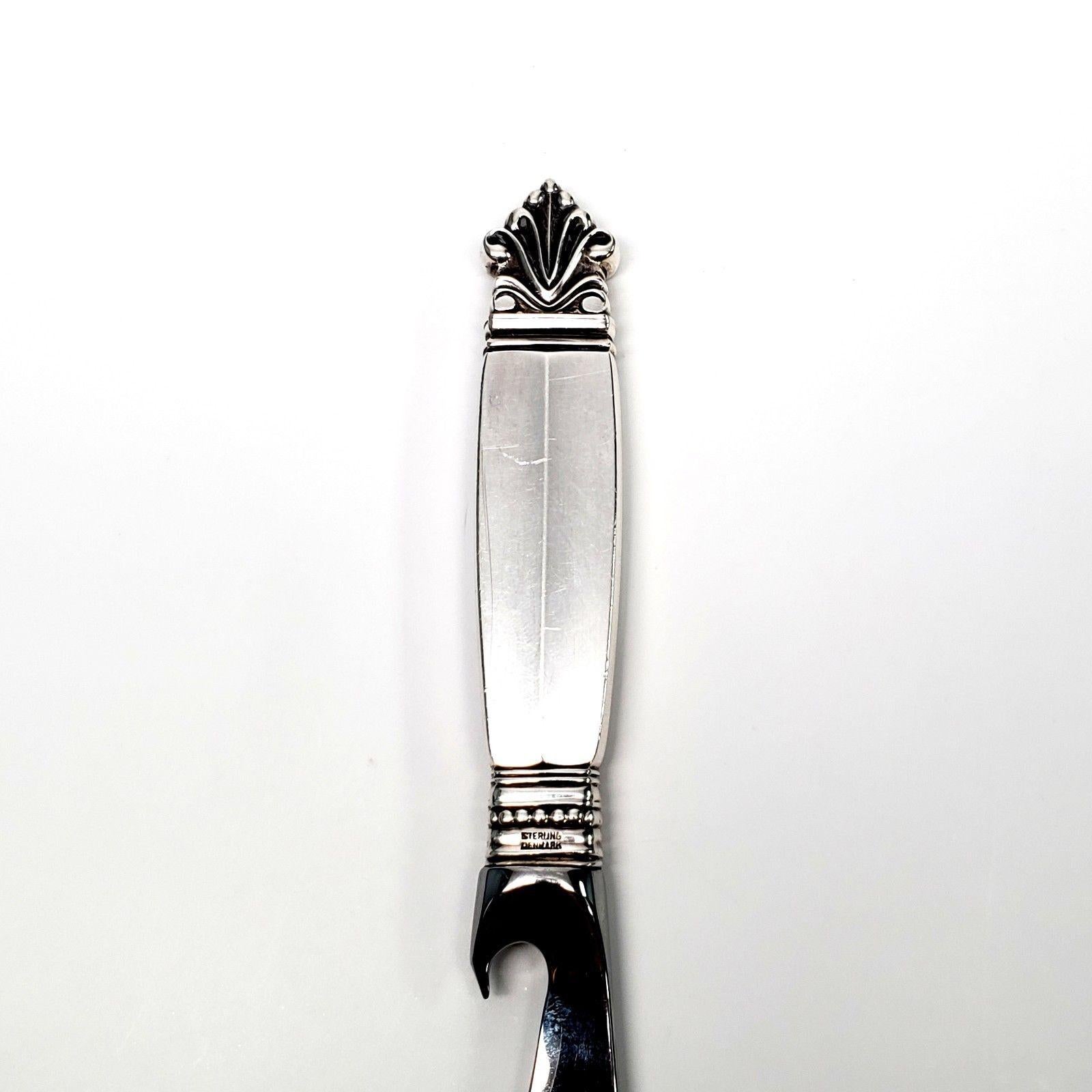 Georg Jensen sterling silver handled bar knife with stainless blade in the Acanthus pattern. Marked: STERLING DENMARK GEORG JENSEN on handle, STAINLESS on blade. Measures 8 1/4