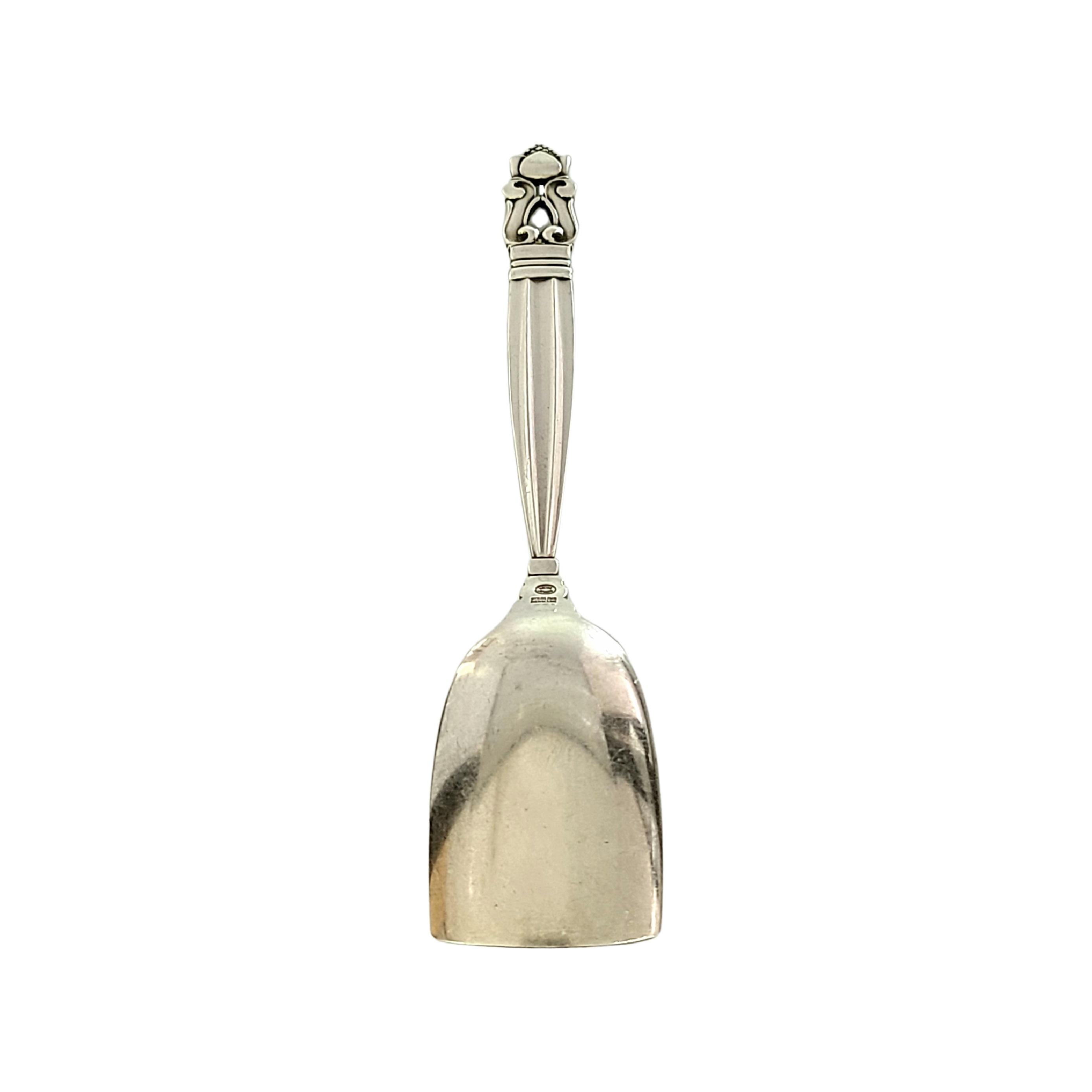 Sterling silver caviar shovel in the Acorn pattern by Georg Jensen

The Acorn pattern was introduced in 1915 as a collaboration between Georg Jensen and designer Johan Ronde. The Acorn pattern, which combines Art Nouveau and Art Deco styles, has
