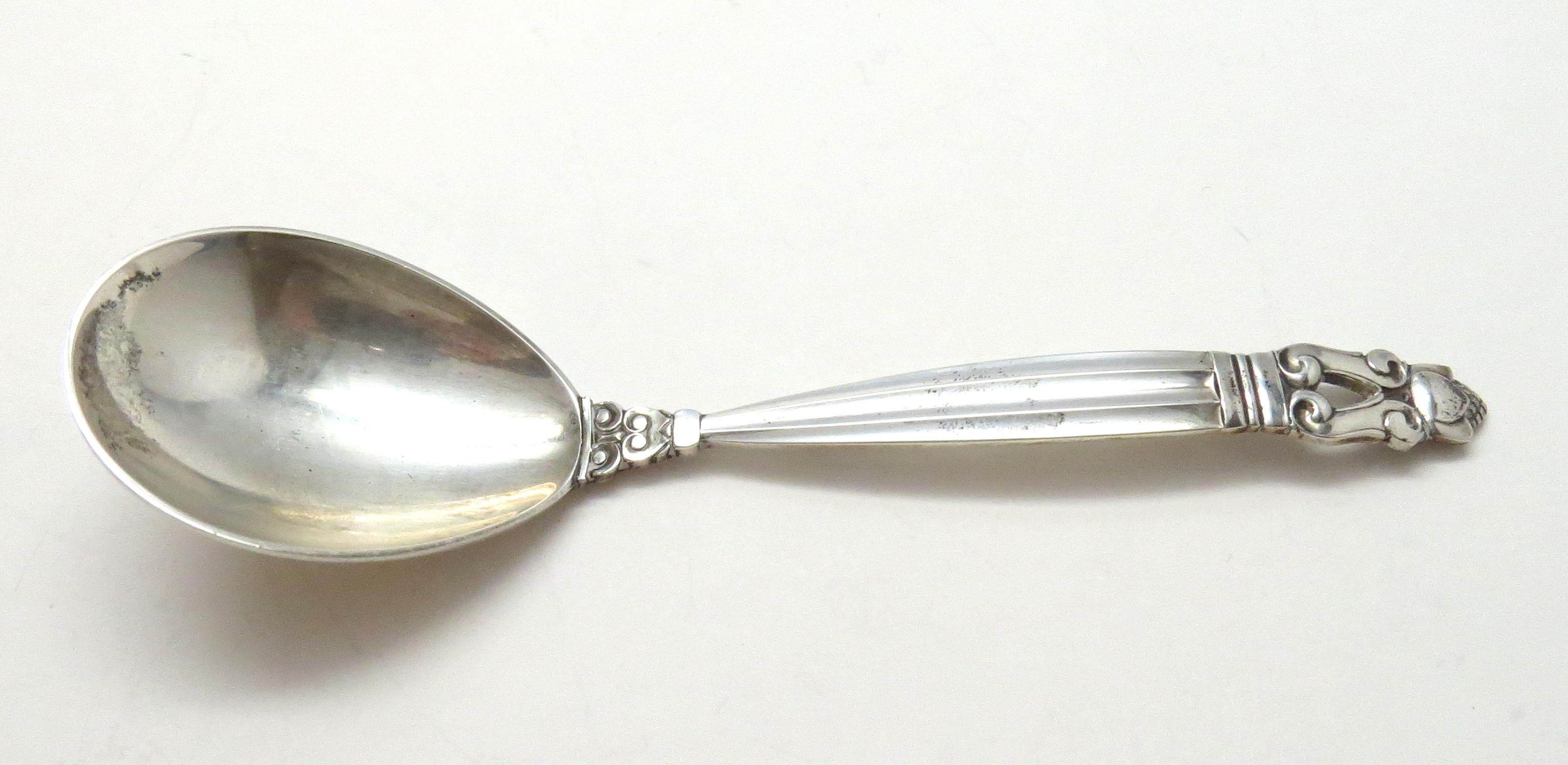 Georg Jensen Denmark sterling silver curved handle jam spoon in the acorn pattern.
Marked: Georg Jensen in dotted circle.
Sterling, Denmark.
No monogram.
Measures: 5 3/4