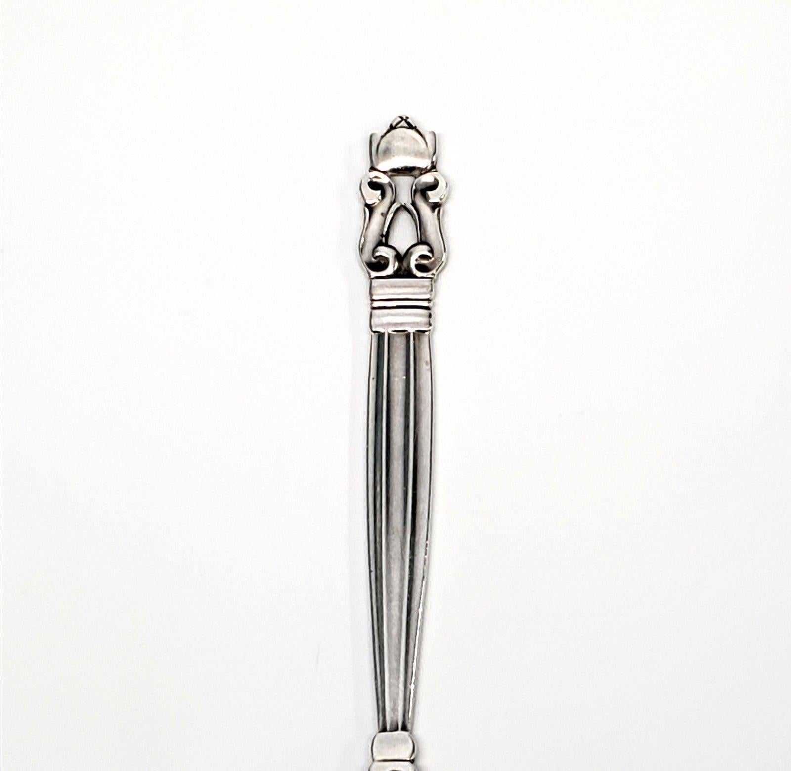 Georg Jensen sterling silver medium teaspoon in the Acorn pattern. 
Marked: GJ DENMARK STERLING. 
Measures: 5 3/4
