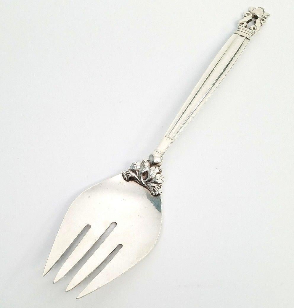 Georg Jensen sterling silver serving/salad fork in the Acorn pattern. 
Marked: GJ STERLING DENMARK. 
Measures 9 3/8