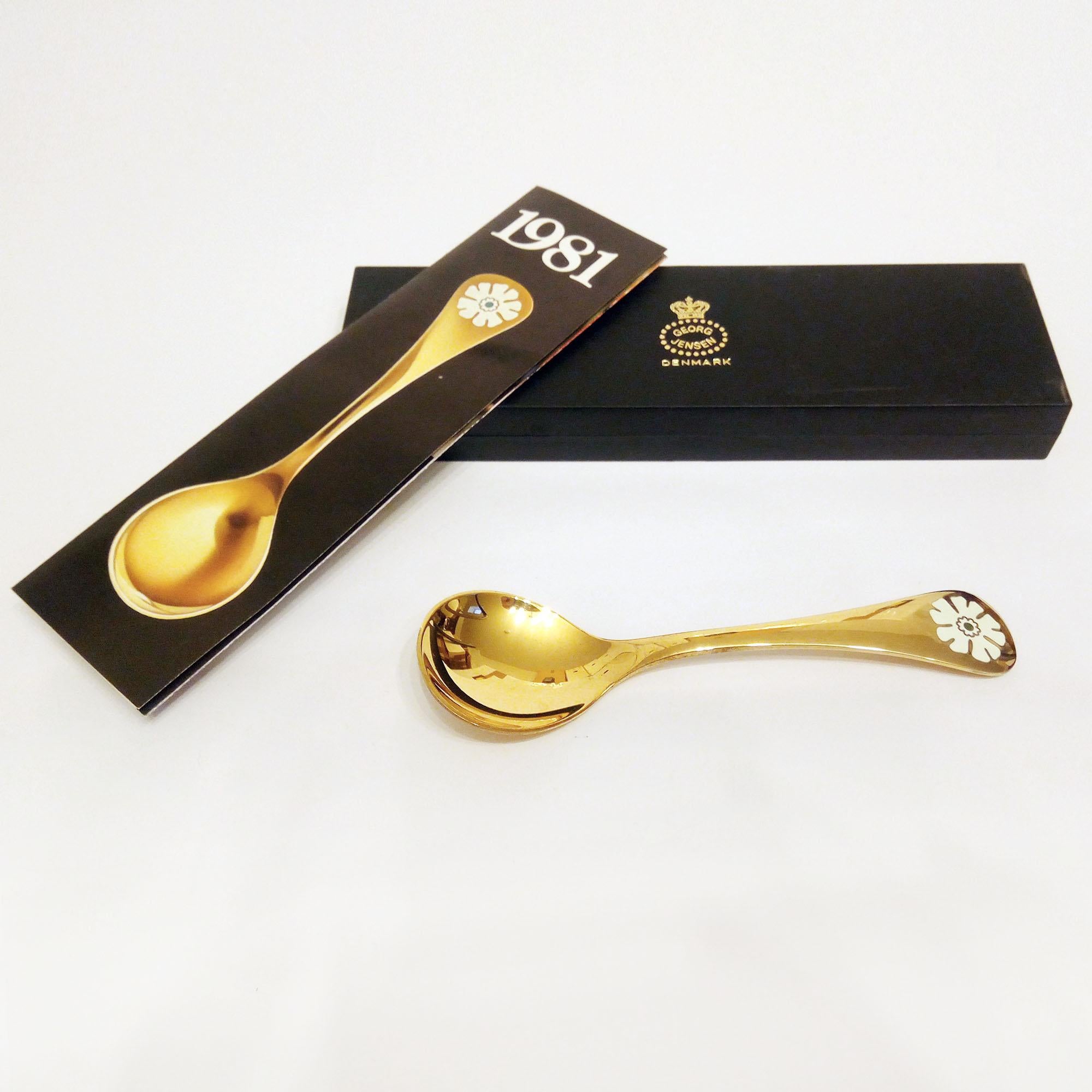 Annual spoon 1981 in original box, designed by Annelise Björner, edited by Georg Jensen.
Annual Spoons series began in 1971. Each spoon is crafted in sterling silver, then gold plated and enameled with a wildflower chosen for that year. The 1981