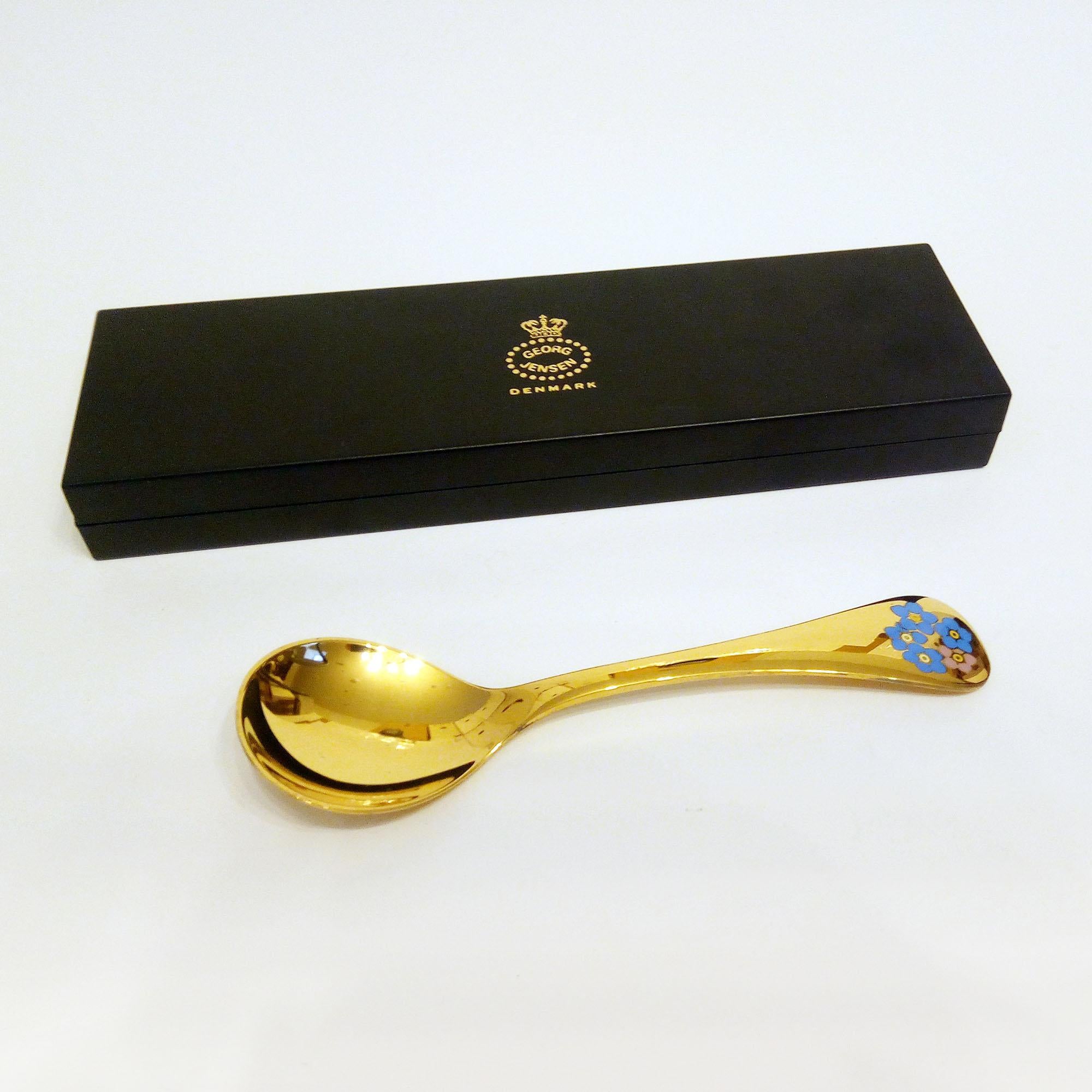 Annual spoon 1983 in original box, designed by Annelise Björner, edited by Georg Jensen.
Annual spoons series began in 1971. Each spoon is crafted in sterling silver, then gold-plated and enameled with a wildflower chosen for that year. The 1983