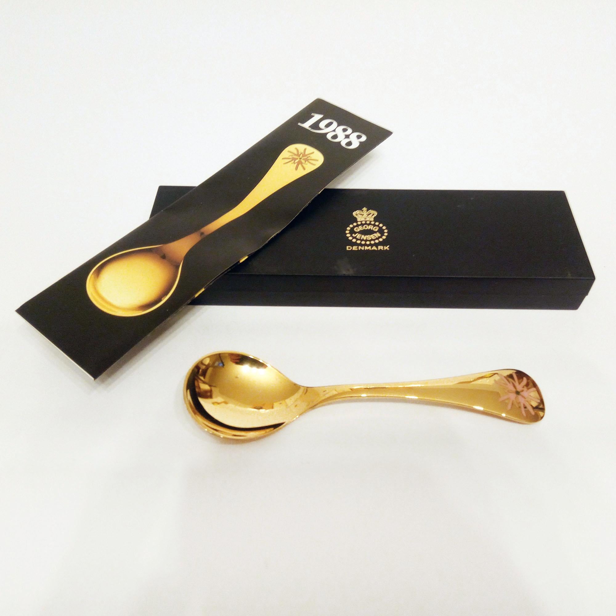 Annual Spoon 1988 in original box, designed by Annelise Björner, edited by Georg Jensen.
Annual Spoons series began in 1971. Each spoon is crafted in sterling silver, then gold plated and enameled with a wildflower chosen for that year. The 1988