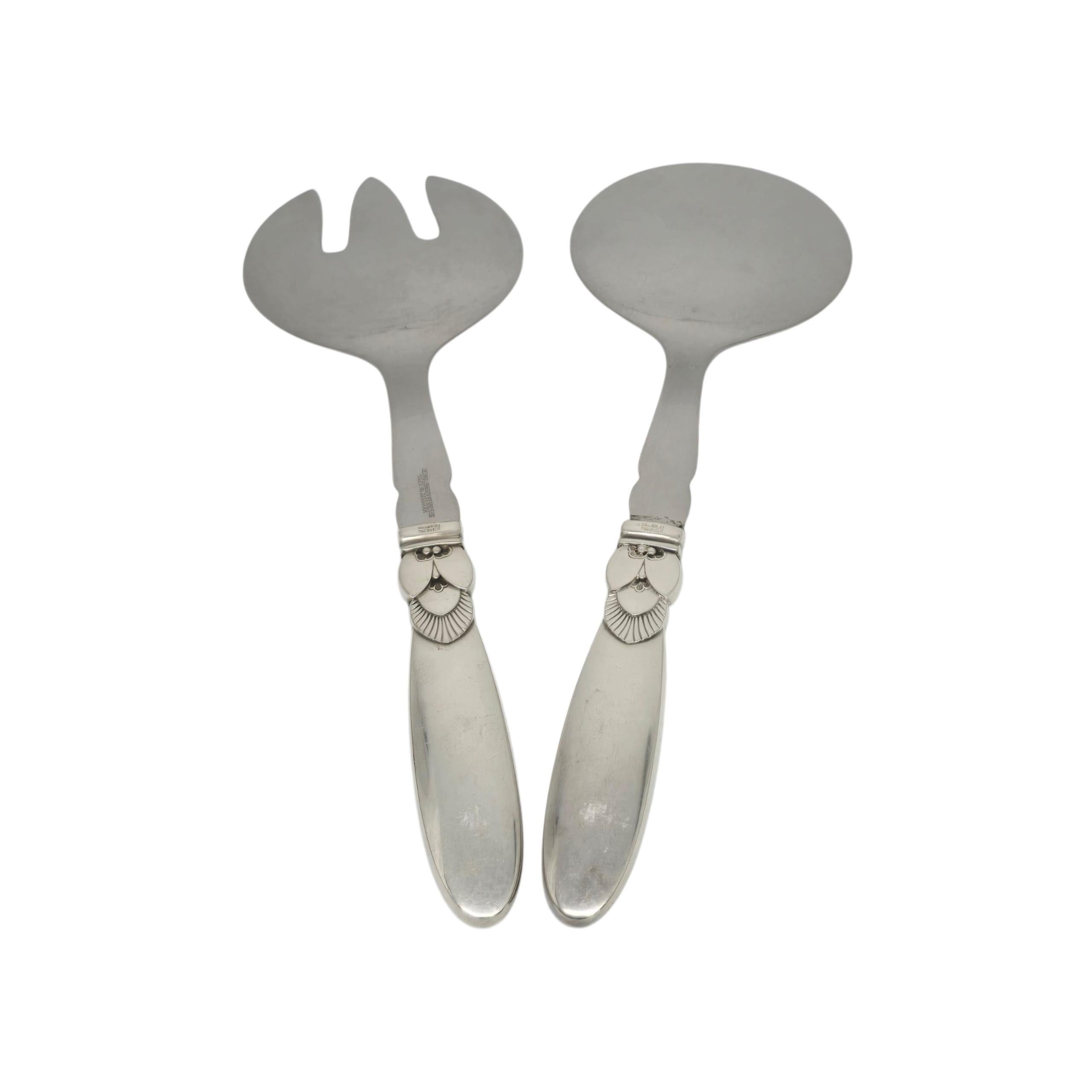 Georg Jensen Denmark Cactus Sterling Silver Handle Serving Fork & Spoon

Created by long-time Jensen designer Gunorph Albertus, the Cactus pattern was introduced in 1930 and features an Art Deco cactus blossom design. This set includes a fork and