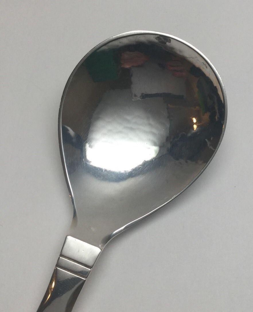 Hammered solid Sterling silver compote serving spoon in the Georg Jensen Denmark 1908 Continental pattern. Marked: GEORG JENSEN in dotted oval, DENMARK STERLING. No monogram. Measures: 7 1/8