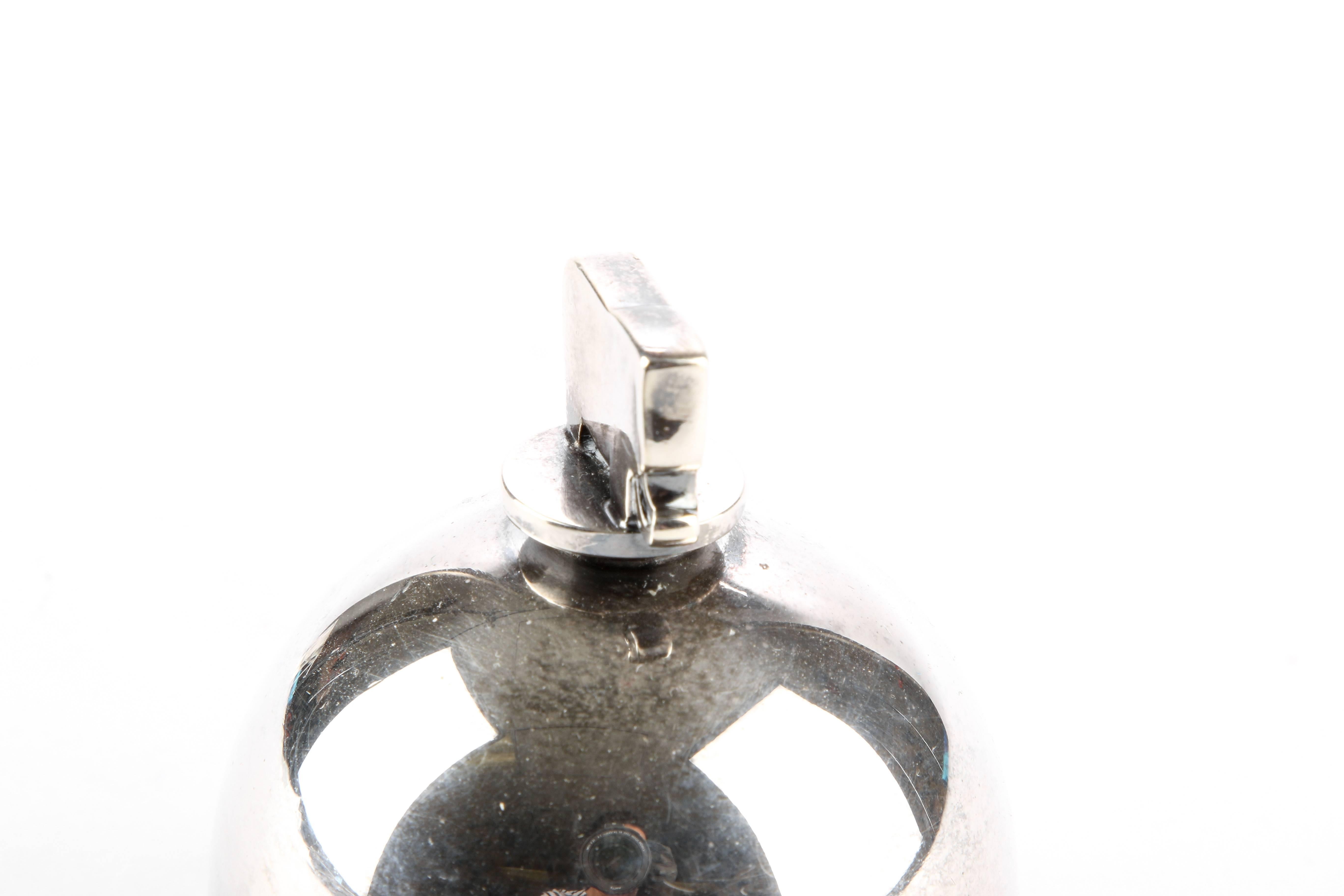 Georg Jensen, Denmark dinner bell having dual recessed bands, solid silver elephant finial and an elongated teardrop clanger.
Identifying marks: Georg Jensen within an oval dotted circle, Sigvaard in script, sterling, #219

Condition: slightly