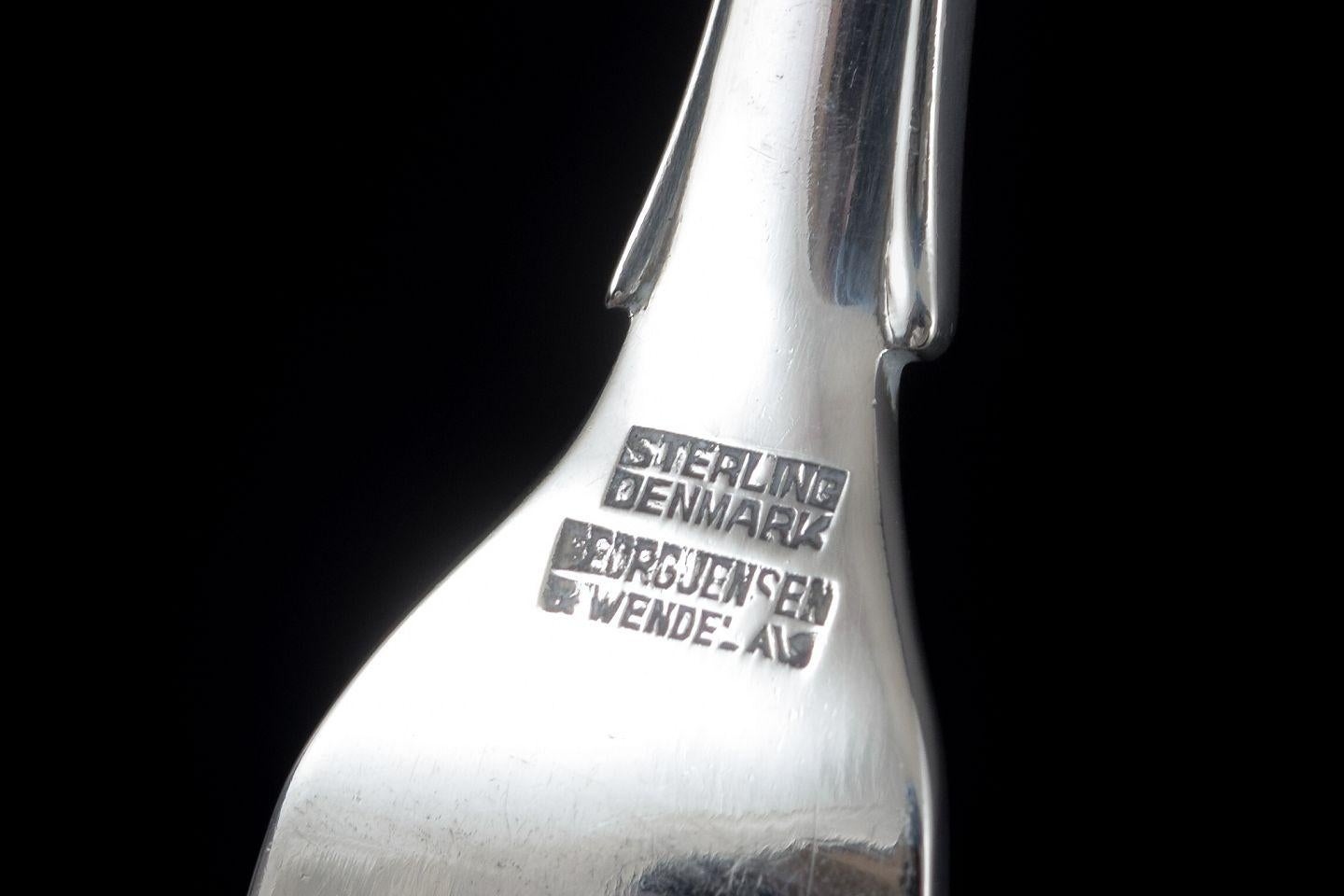 PRE-OWNED GOODS ARE EXEMPT FROM IMPORT TARIFFS FOR U.S., UK, AUSTRALIAN & CANADIAN CUSTOMERS.   
THEREFORE, NO IMPORT TARIFFS WILL BE APPLICABLE TO YOUR PURCHASE. 

Georg Jensen. Fish knife in the “Lily of the Valley” pattern. Mirror-polished