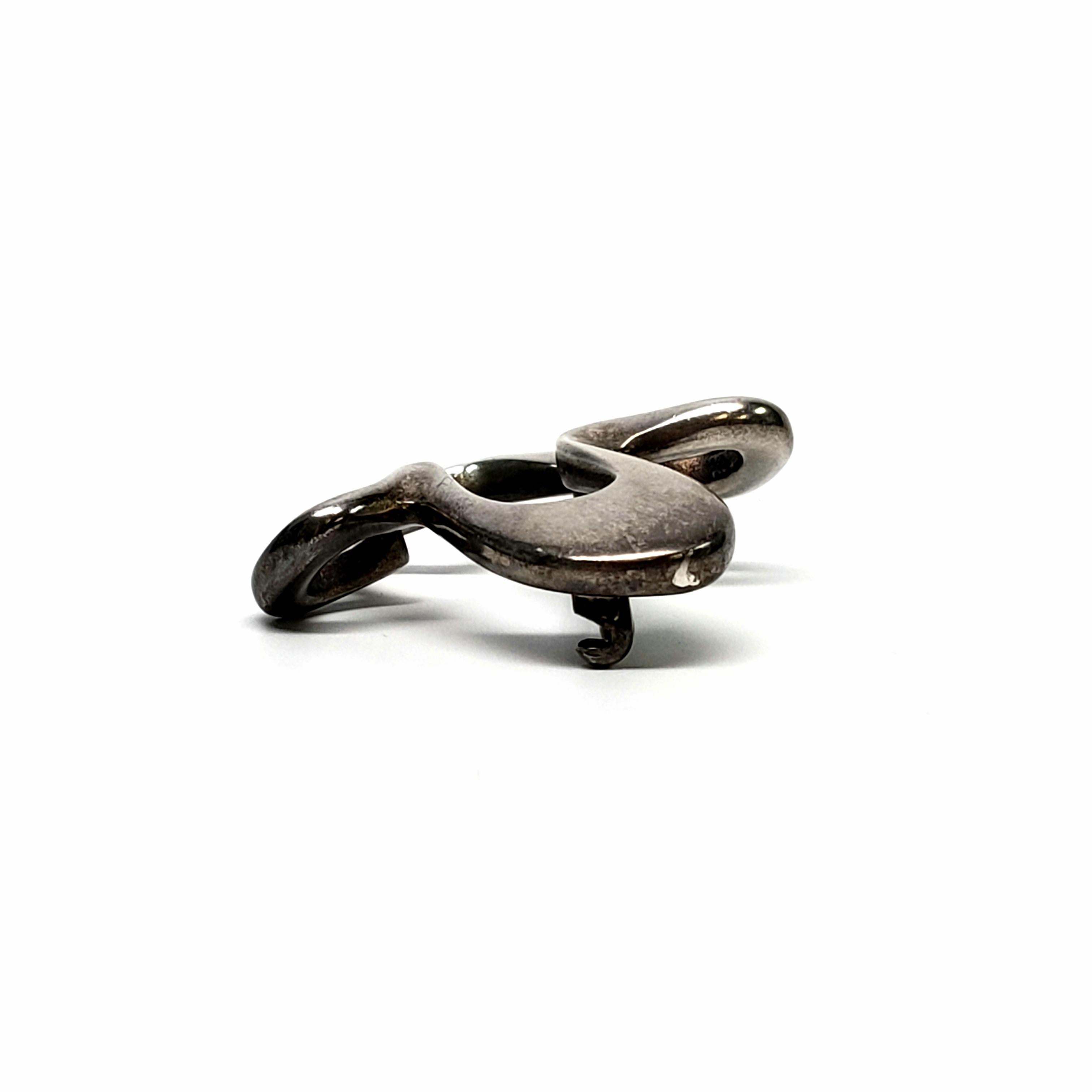 Vintage Georg Jensen sterling silver #321 Splash pin, circa 1945.

This beautiful asymmetrical piece designed by Henning Koppel for Georg Jensen was originally launched in the 1940s and continues to be a classic today.

Measures 1 1/2