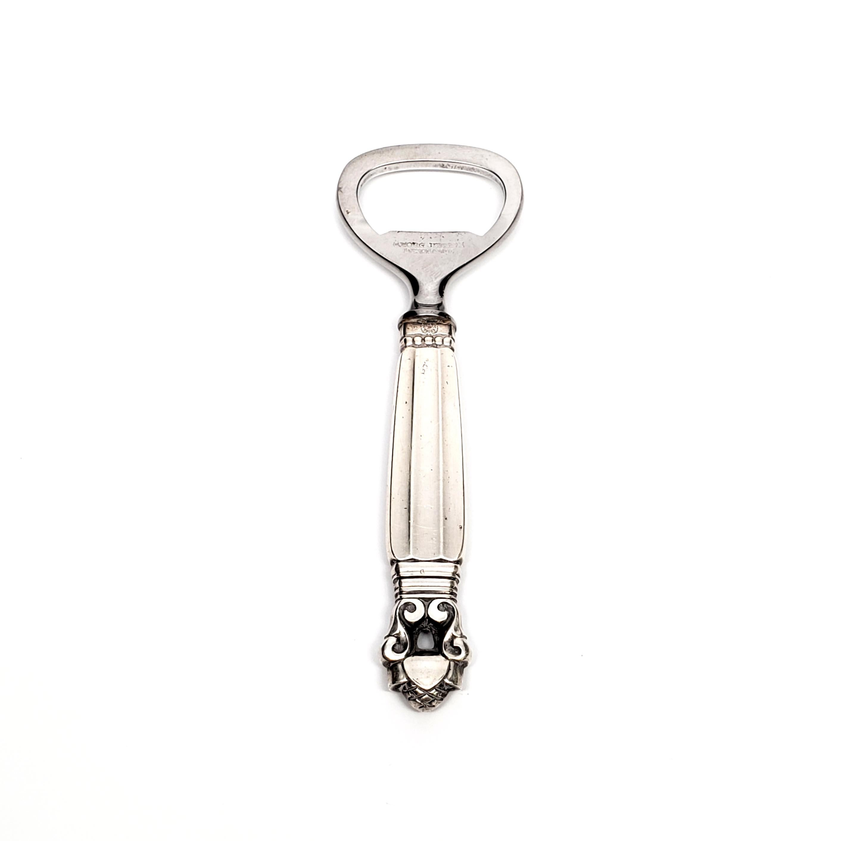 Sterling silver handle bottle opener with stainless implement from Georg Jensen in the Acorn pattern.

The Acorn pattern was introduced in 1915 as a collaboration between Georg Jensen and designer Johan Ronde. The Acorn pattern, which combines Art