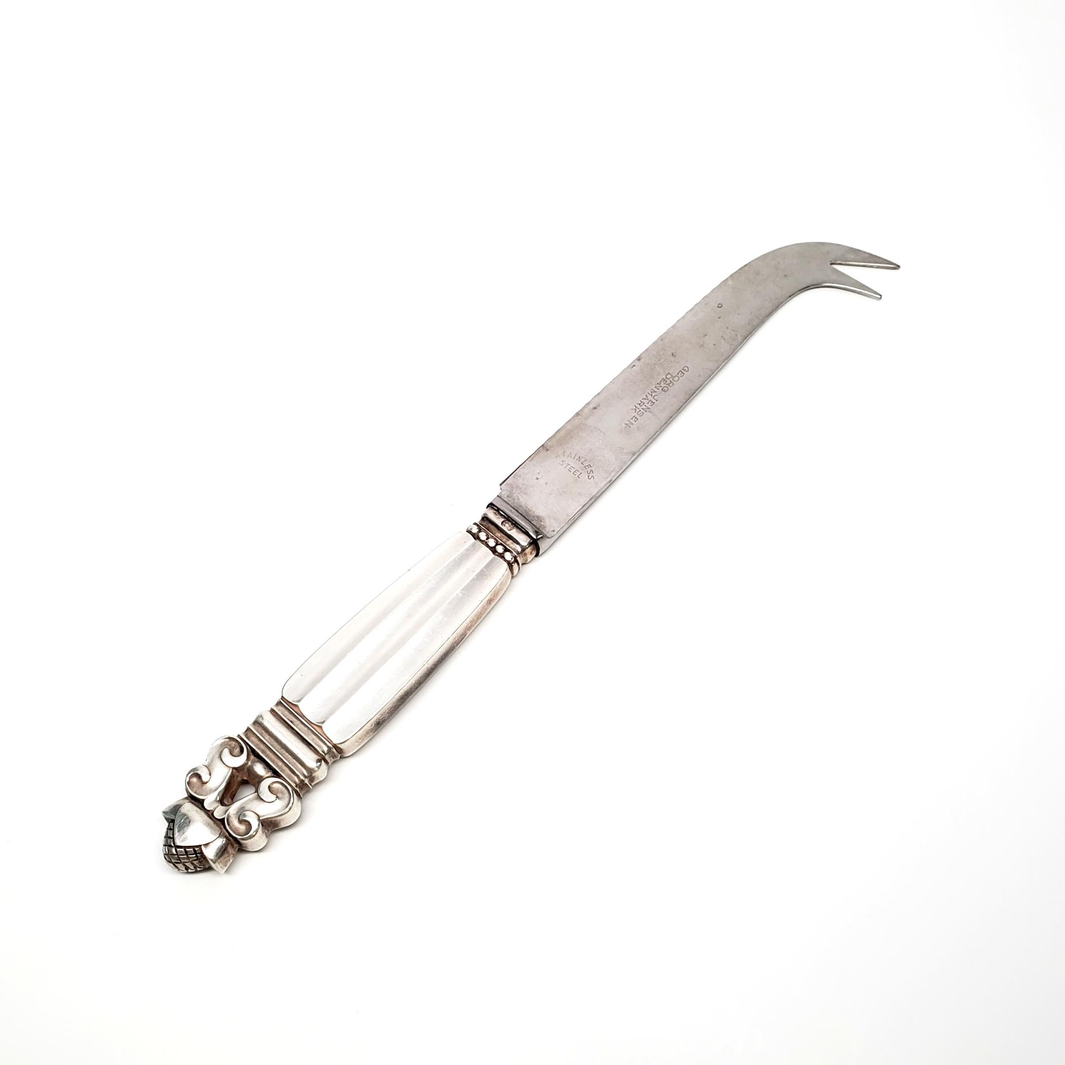 Vintage sterling silver cheese/bar knife from Georg Jensen in the Acorn pattern.

The Acorn pattern was introduced in 1915 as a collaboration between Georg Jensen and designer Johan Ronde. The acorn pattern, which combines the Art Nouveau and Art