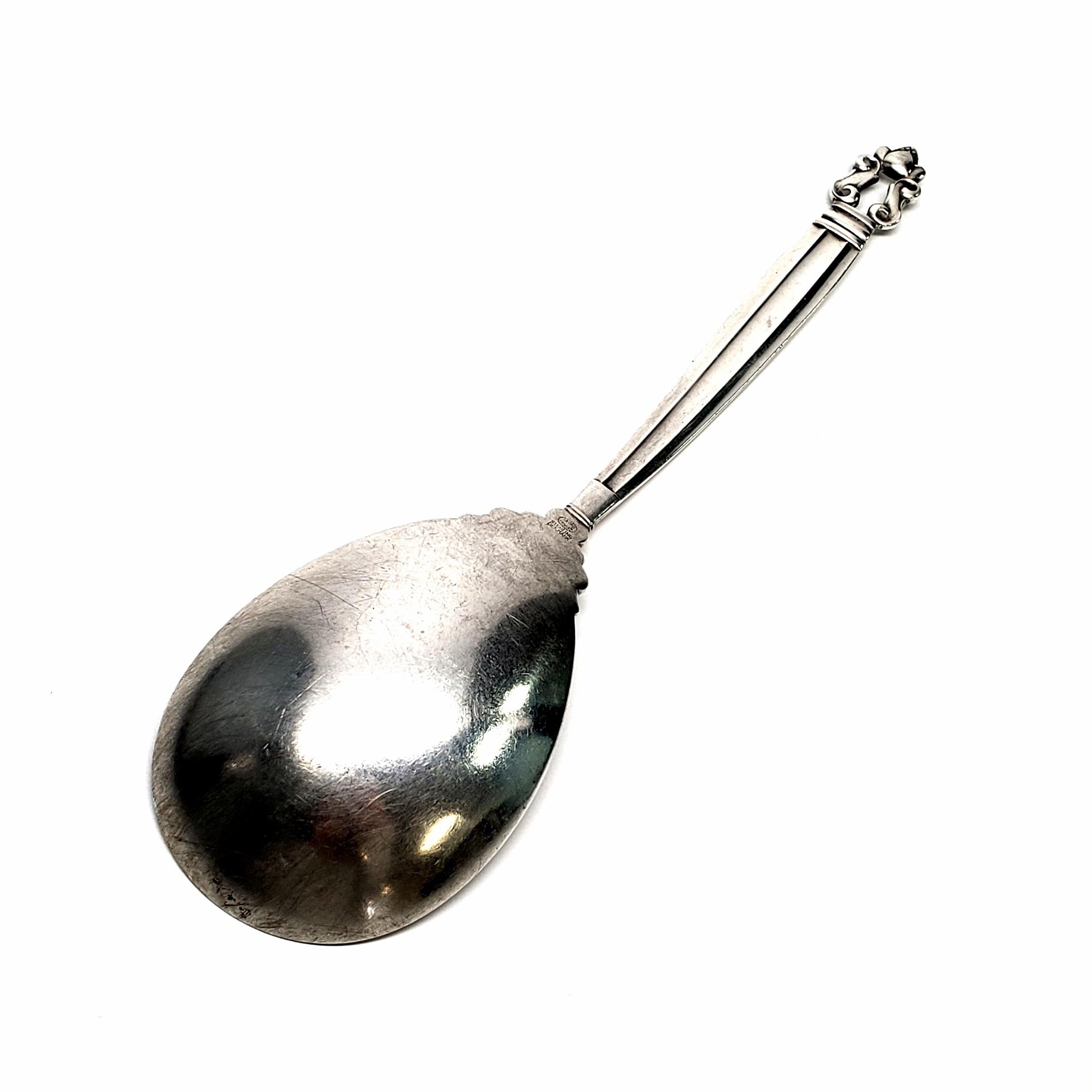 Vintage sterling silver medium serving spoon from Georg Jensen in the Acorn pattern.

The Acorn pattern was introduced in 1915 as a collaboration between Georg Jensen and designer Johan Ronde. The pattern combines Art Nouveau and Art Deco styles,