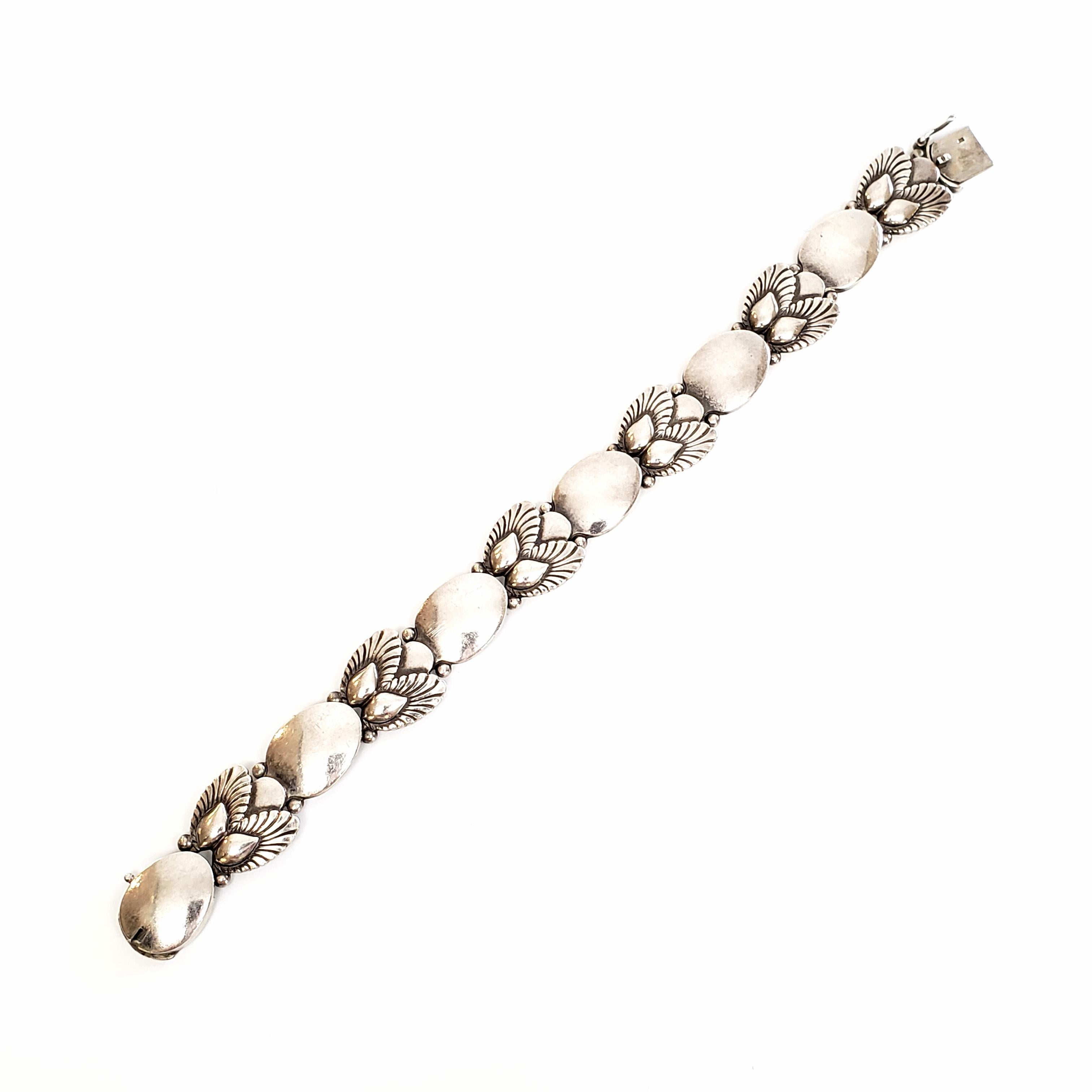 Vintage Georg Jensen sterling silver bracelet in the Bittersweet pattern, #94B, circa 1945.

The Bittersweet flatware pattern was designed by Gundorph Albertus in 1940. This bracelet is typical of Georg Jensen pieces in that it is inspired by nature