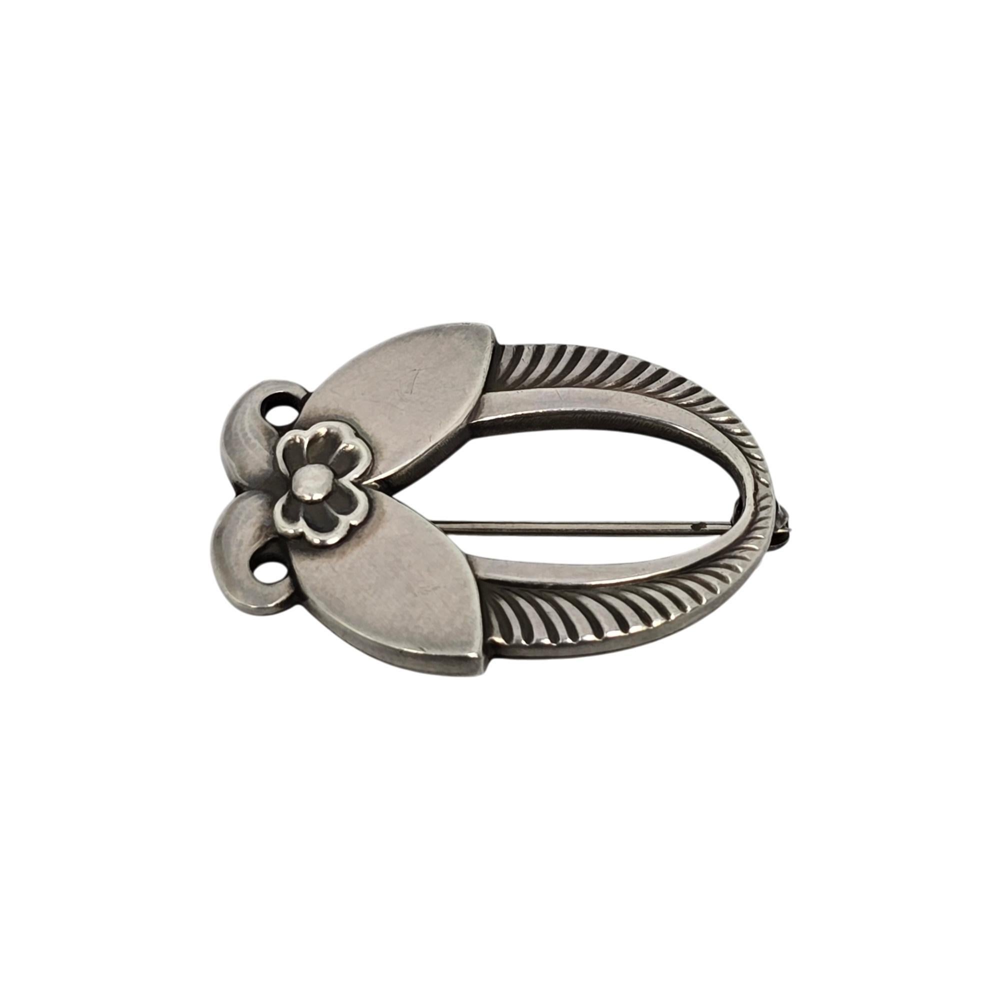 Vintage sterling silver Cactus pin by Georg Jensen, Denmark.

Pattern #227, featuring Jensen's iconic Cactus design on a pin/brooch.

Measures approx 1 1/4