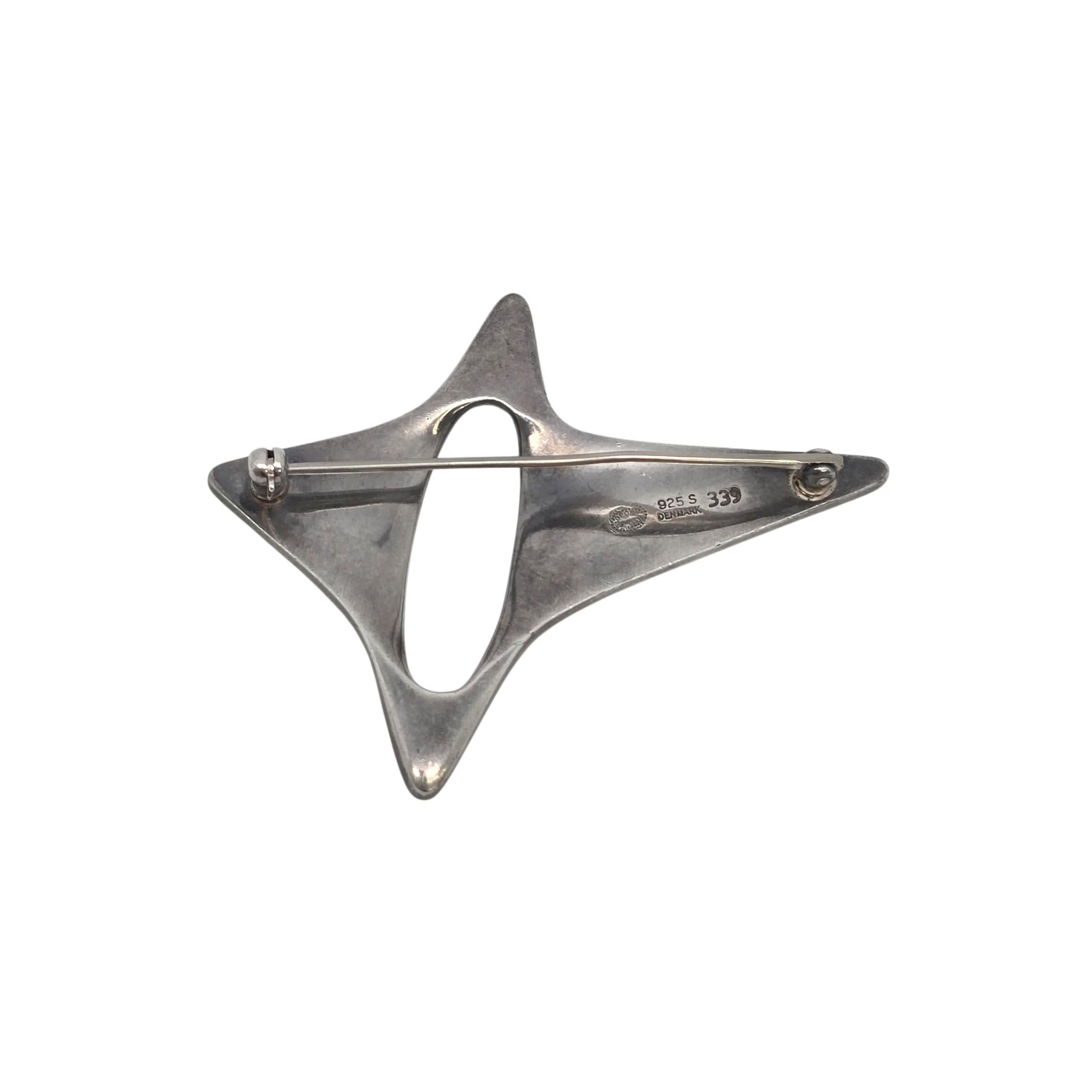 Georg Jensen Denmark Sterling Silver Pattern 339 Modern Star Pin/Brooch

This modernist star pin/brooch was designed by Henning Koppel pattern # 339.

Weighs approx 22.0g, 14.1dwt

Measures approx 1 7/8