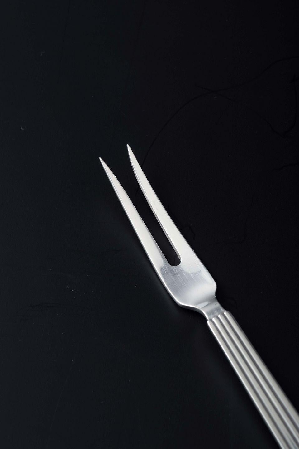 Danish Georg Jensen, Denmark. Sterling silver serving fork in Bernadotte pattern For Sale