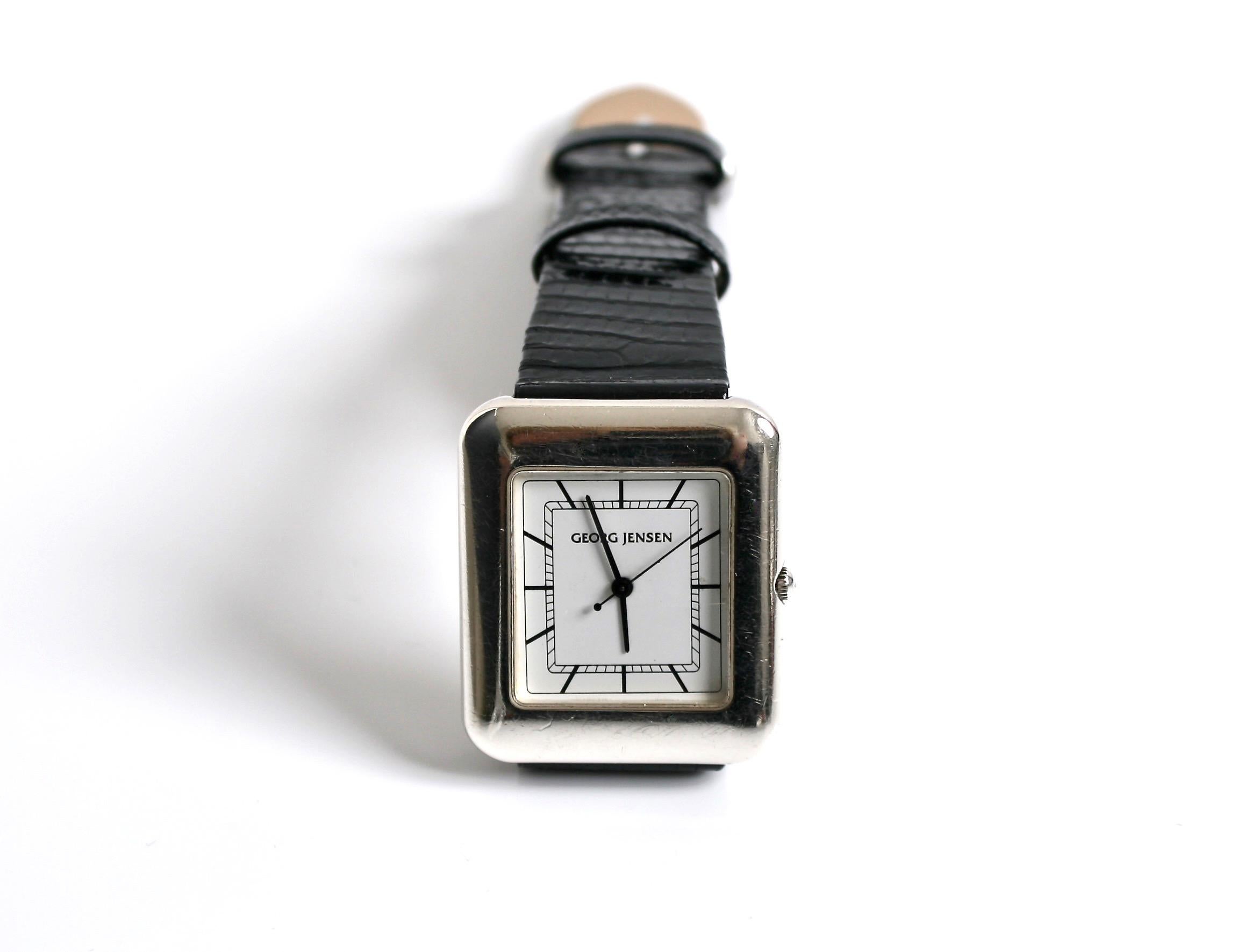 Rare Georg Jensen Sterling silver quartz Watch Designed by Lene Munth Denmark c1980
Crisp white face with with black hands, numbers & second hand
Original Hirch Lizard black strap with sterling silver buckle with Georg Jensen logo
Swiss made water